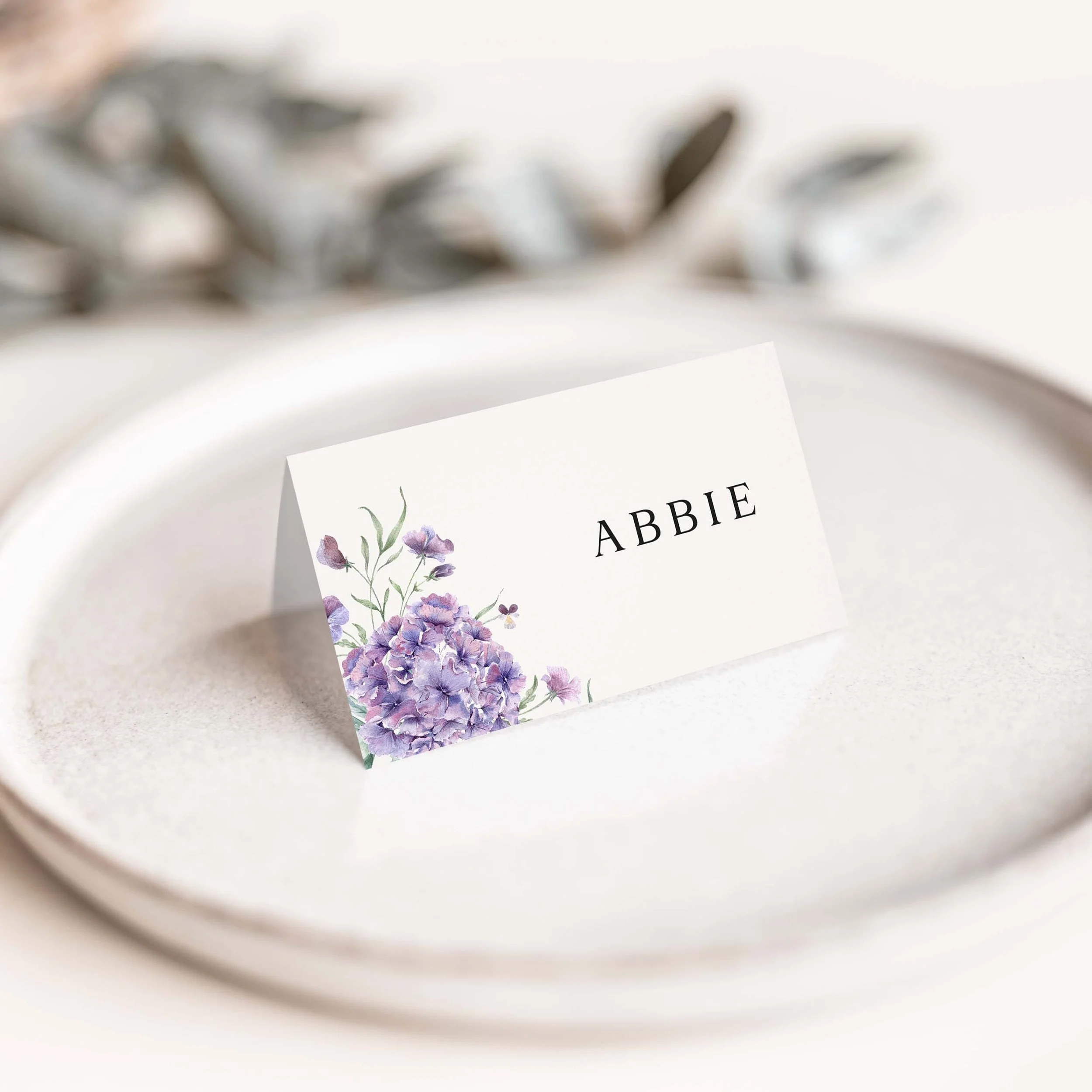 Hydrangea wedding place card with purple floral corner detail