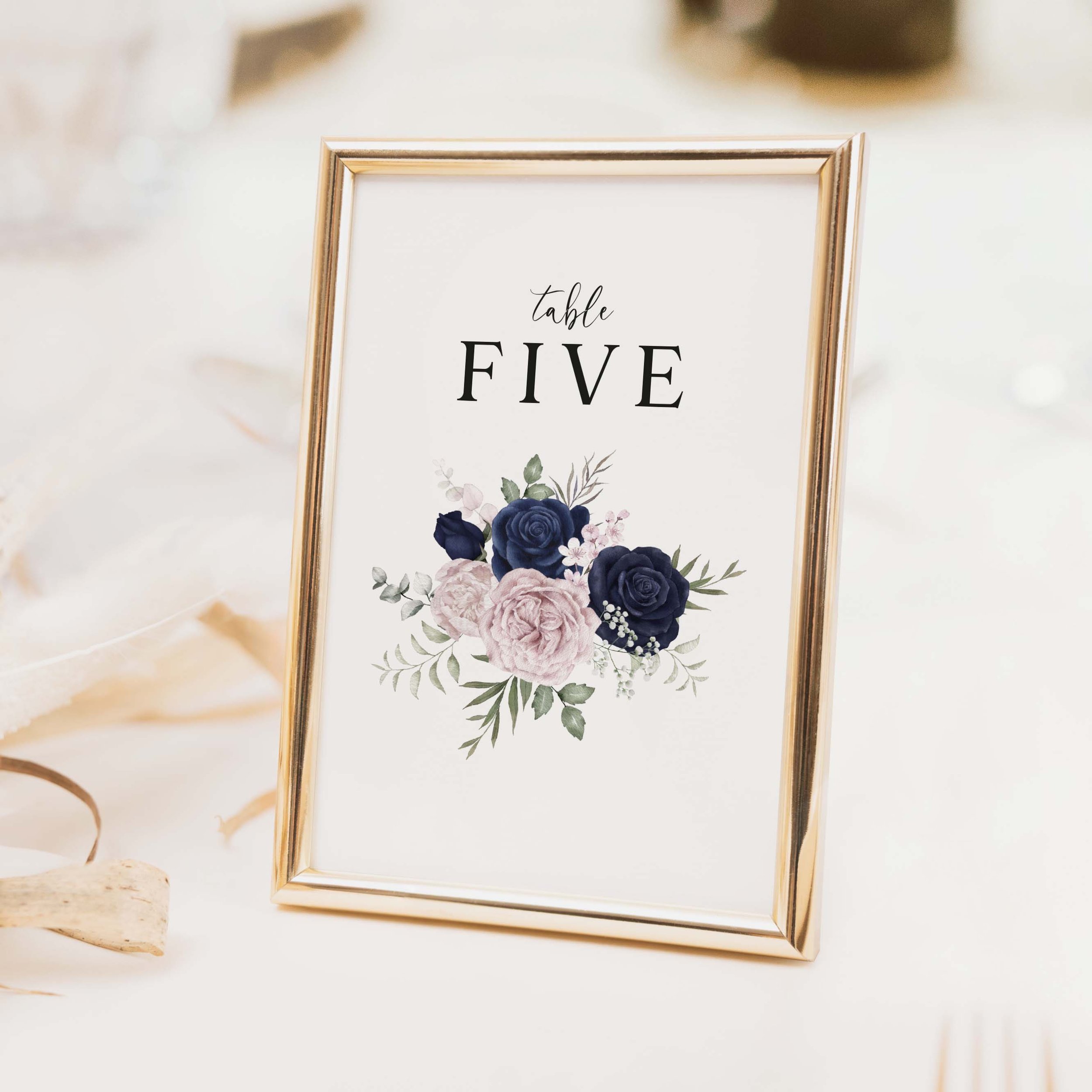 Navy and Blush wedding table number with deep navy and dusty rose floral illustration and elegant script typography on luxury off-white card