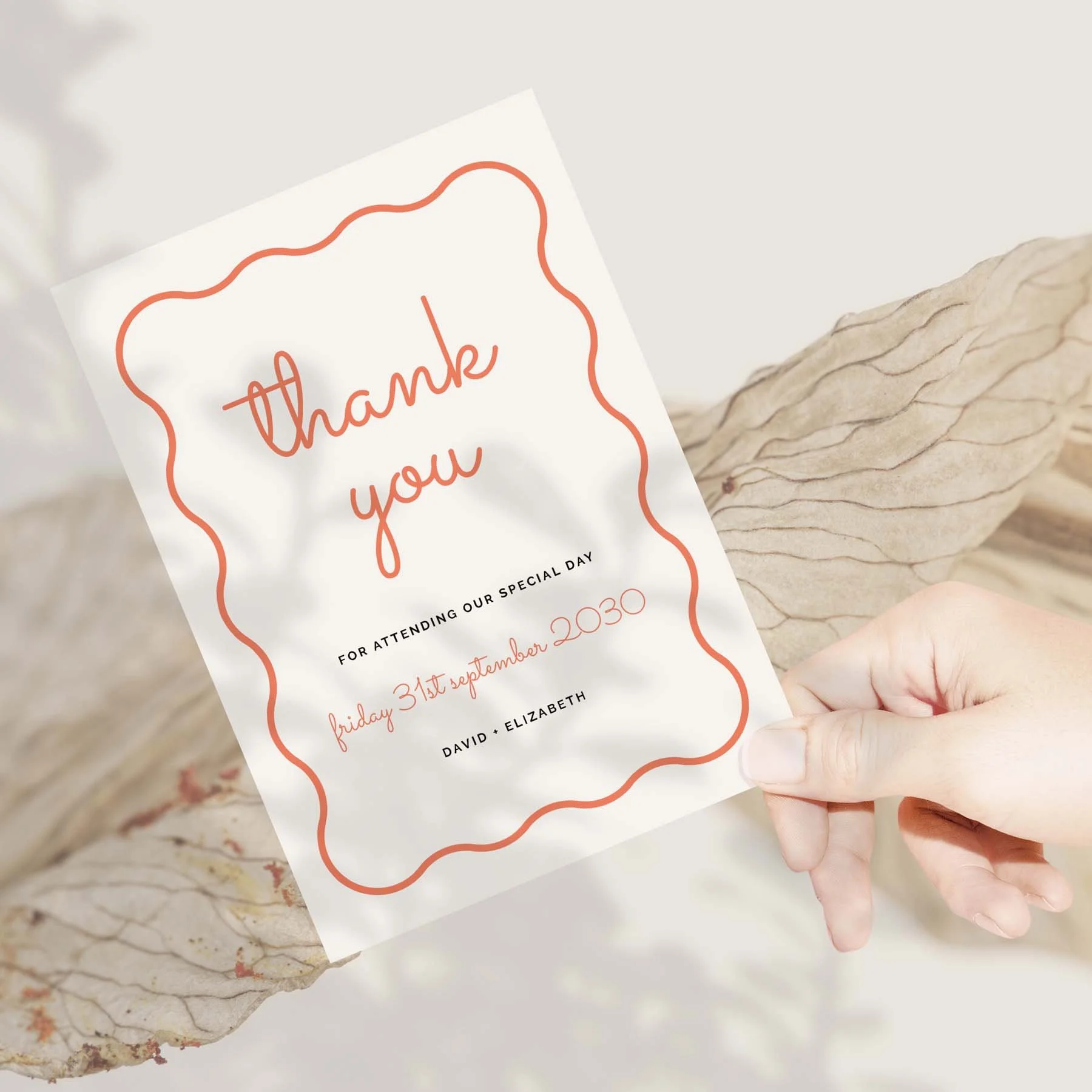 Hand holding a Squiggly Lines wedding thank you card