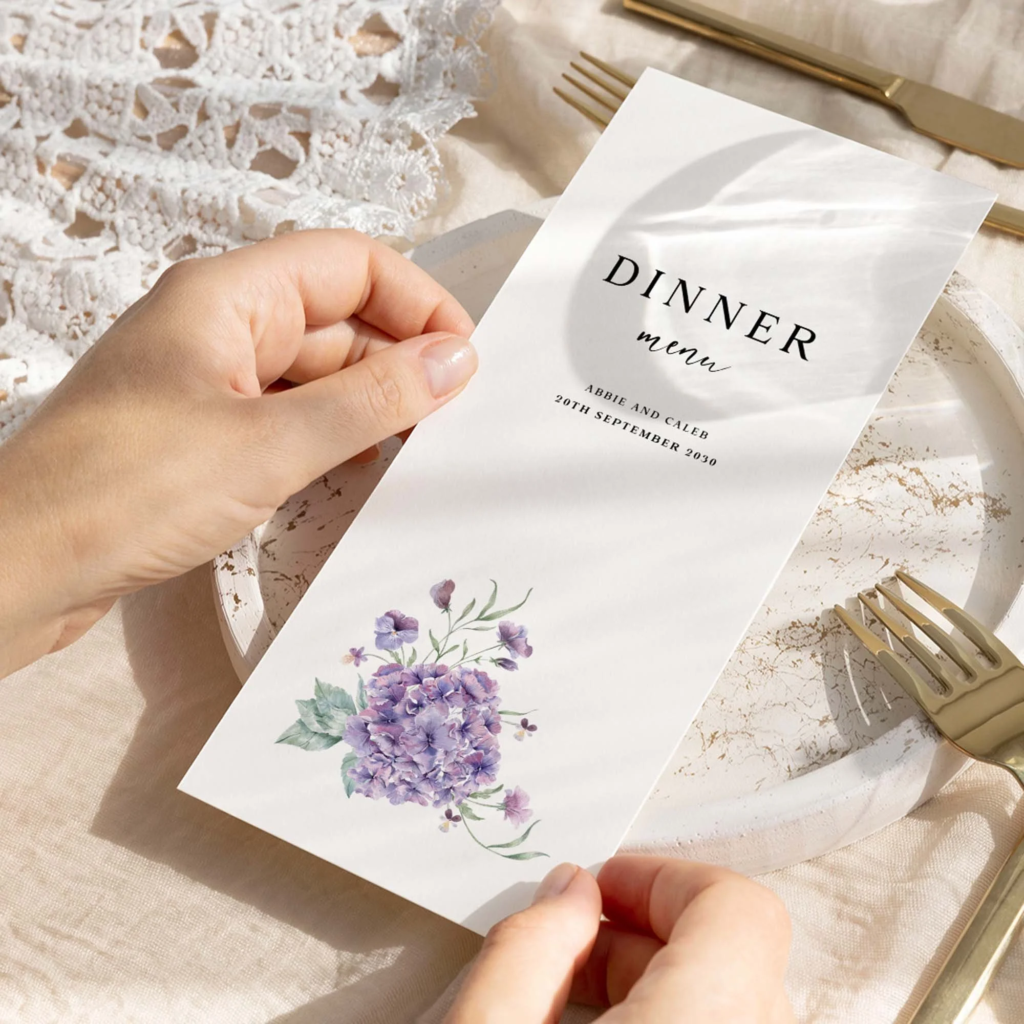 Hand holding Purple Hydrangea wedding menu card showing size and printed design details