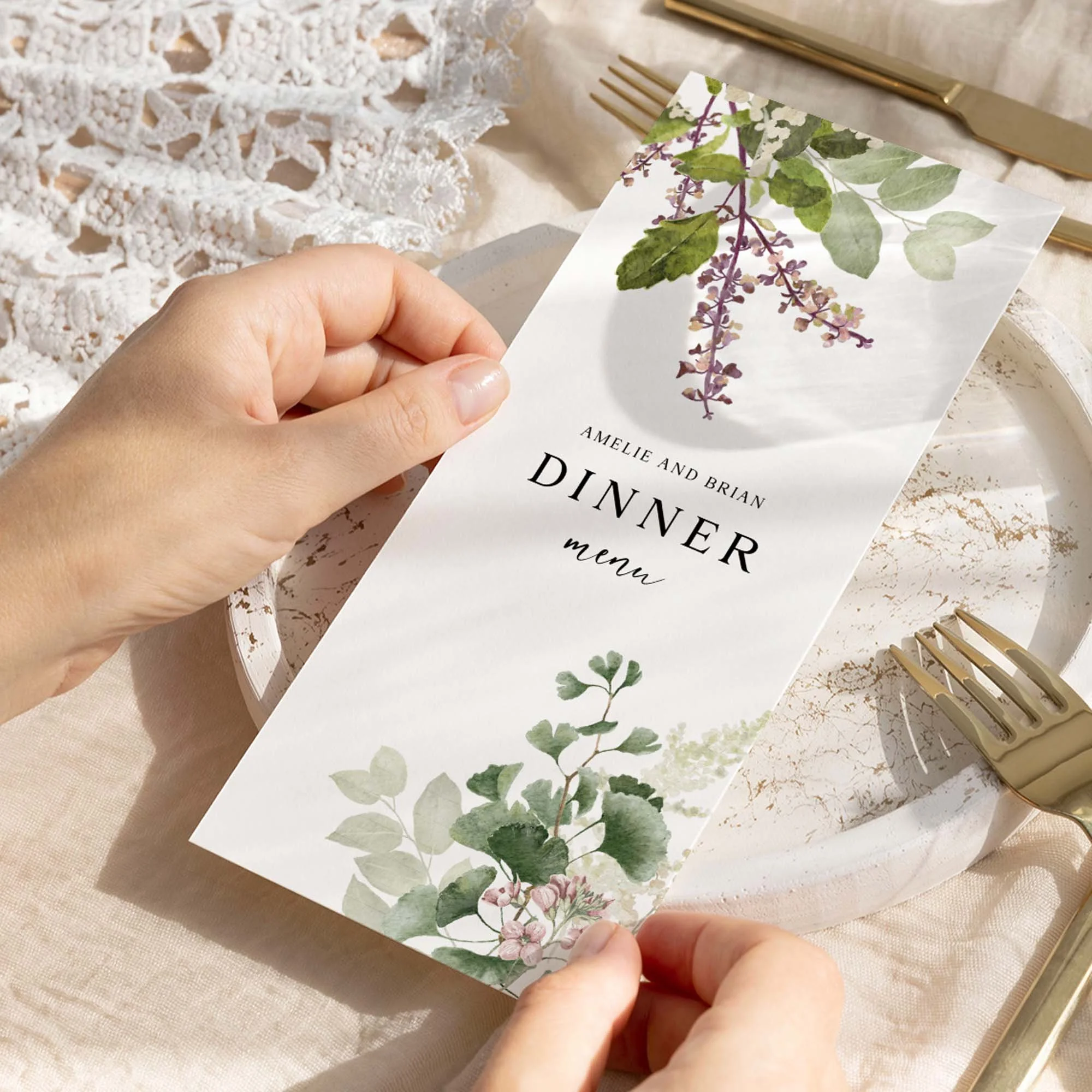 Hand holding Forest Leaves wedding menu card showing size and printed design details