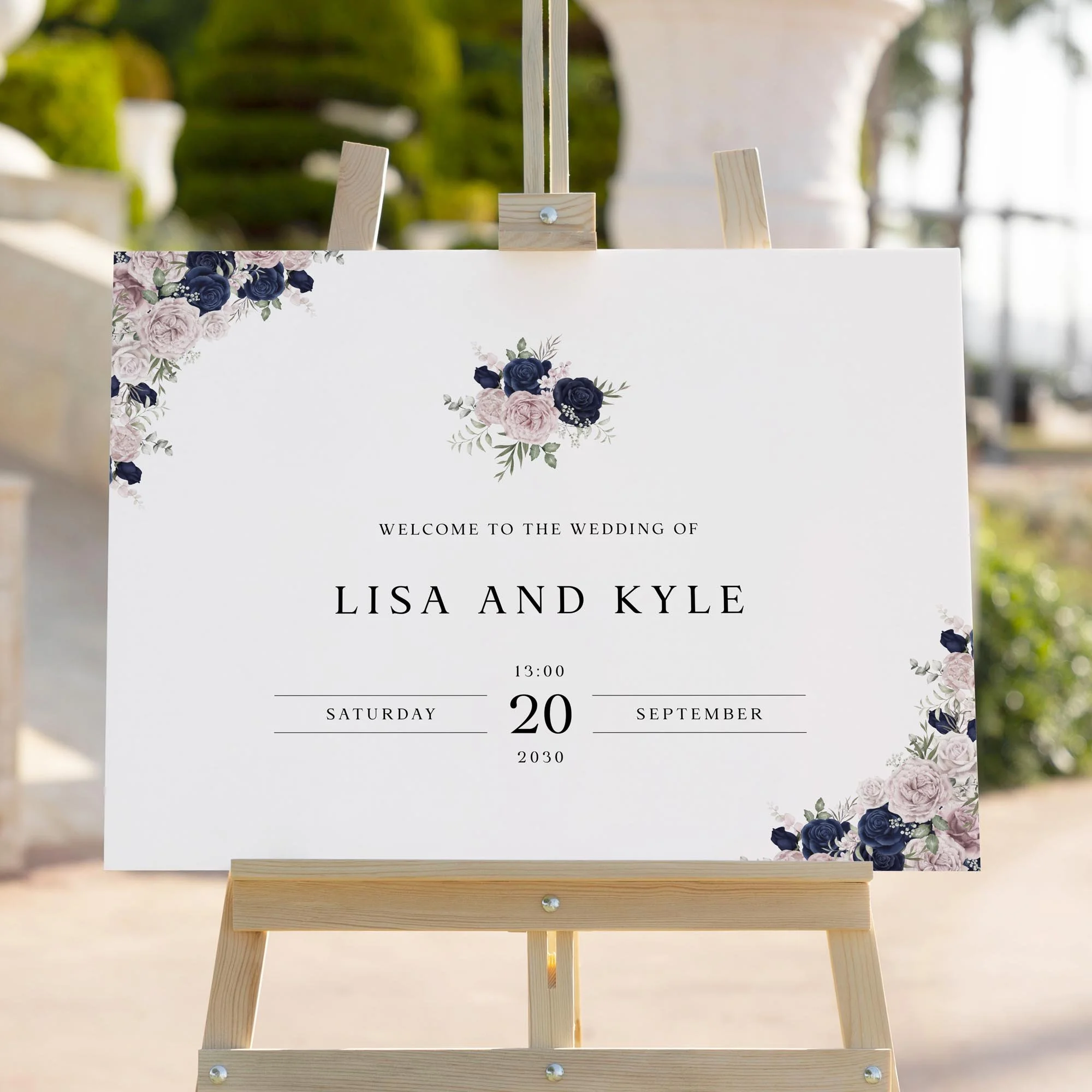 Navy Blue and Blush Pink Floral wedding welcome sign styled outdoors close-up