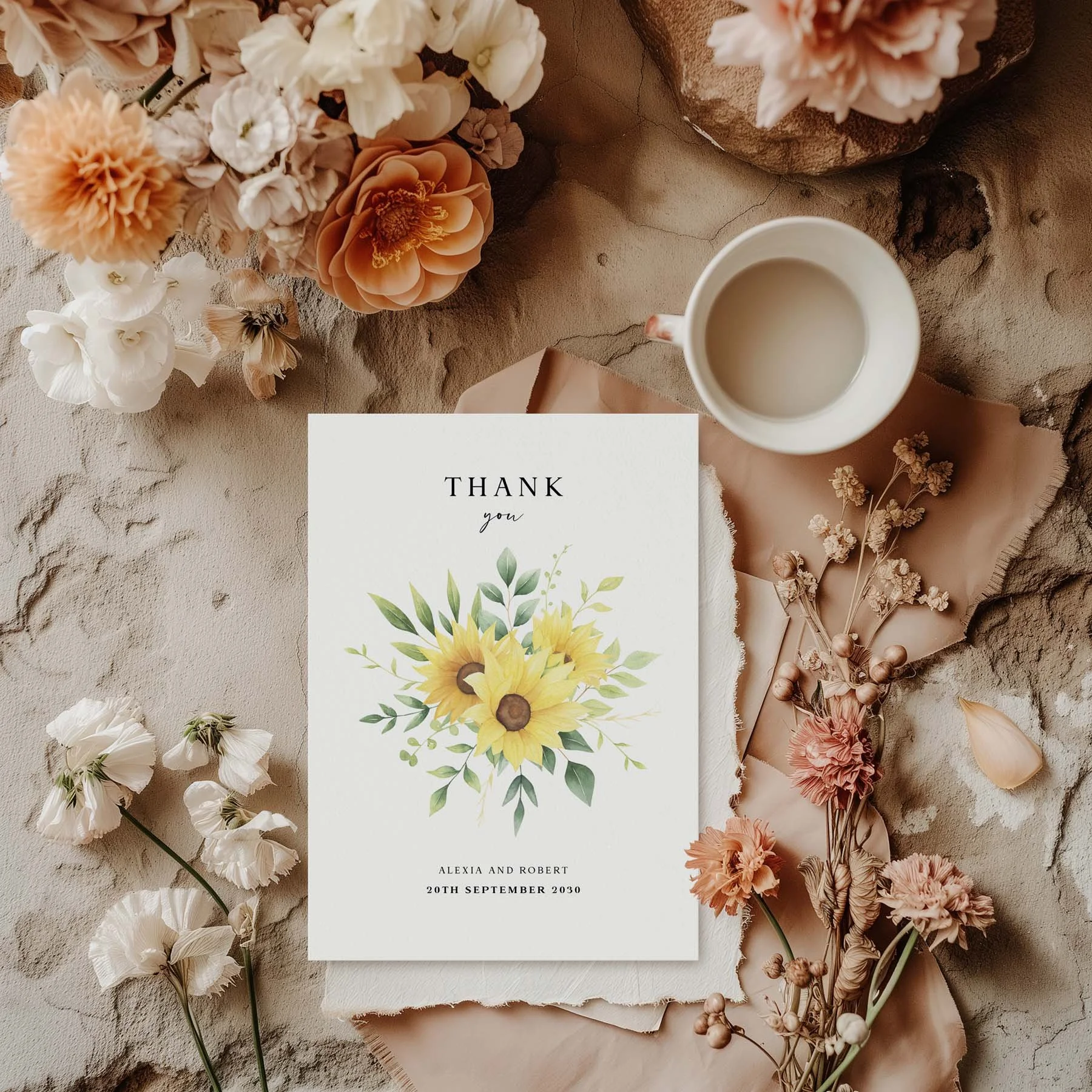 Sunflower wedding thank you card styled with flowers and stationery details