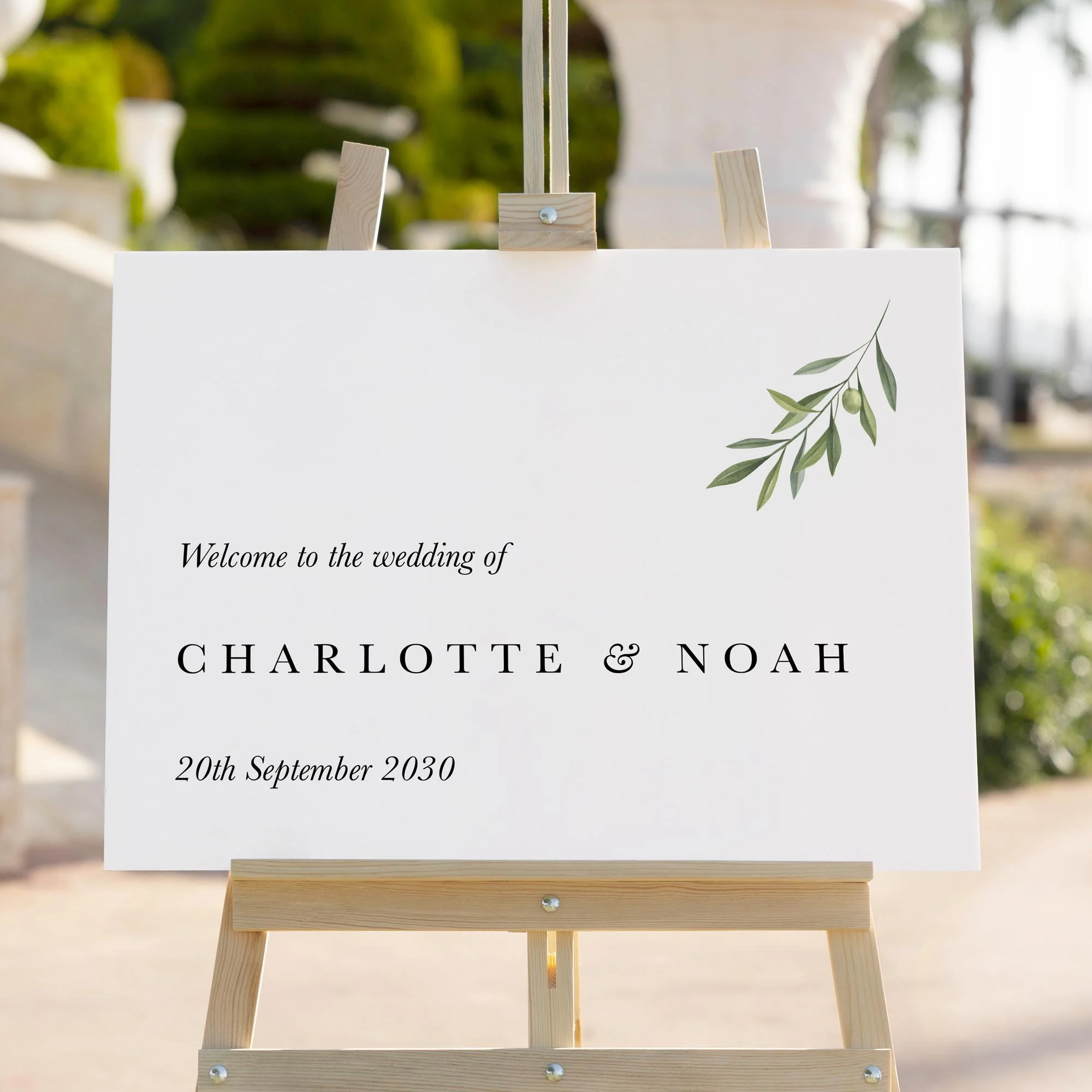 Olive wedding welcome sign styled outdoors close-up