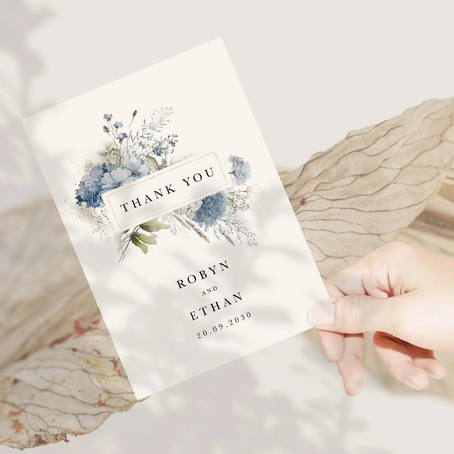 Hand holding a Dusty Blue wedding thank you card