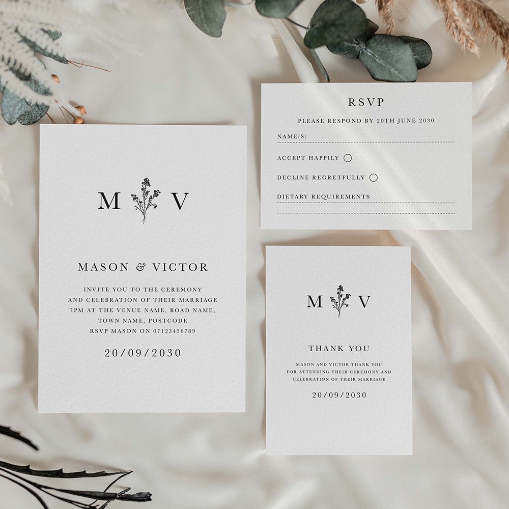 Black and white monogram wedding stationery. Feature initials either side of a delicate branch illustration.
