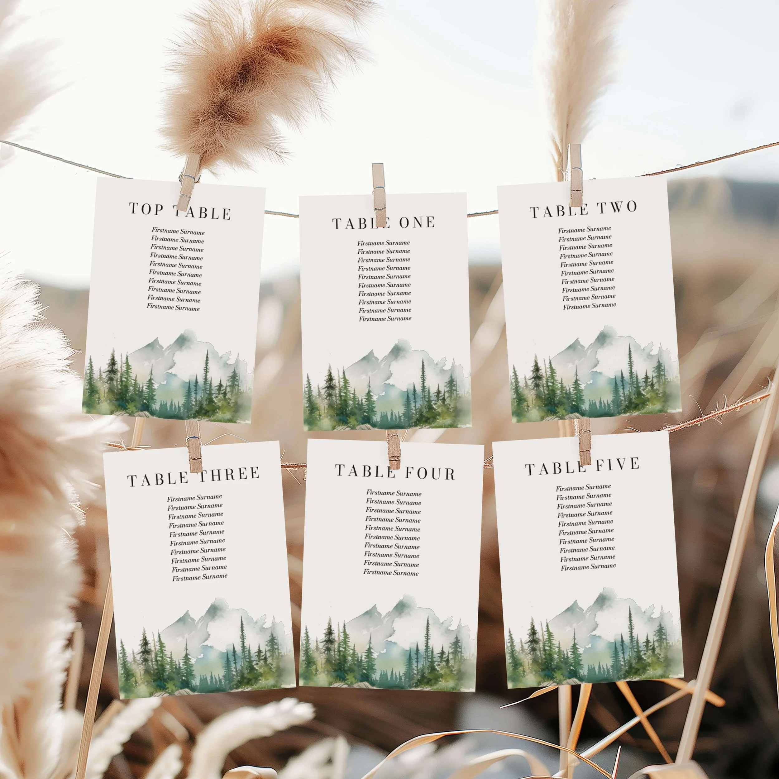 Wilderness wedding seating plan cards, featuring a watercolour mountain lake design with multiple guest tables