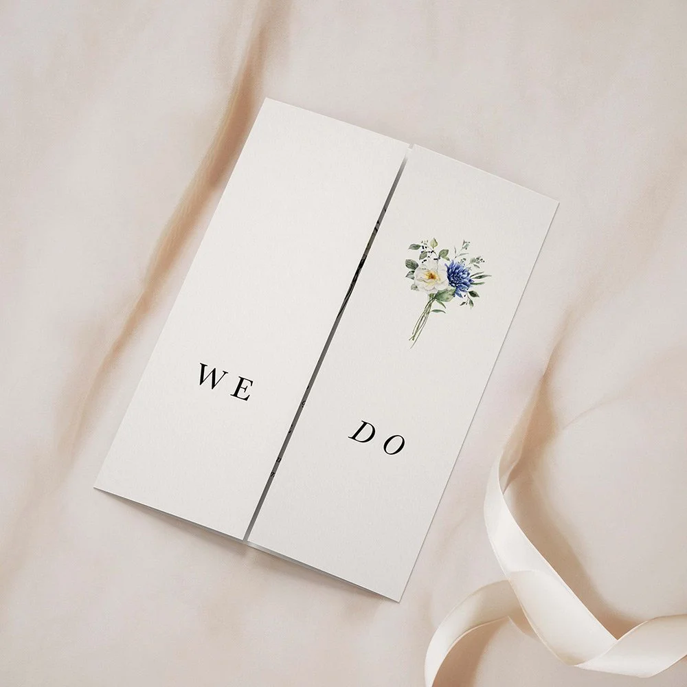 Blue Floral Collection (Bouquet) gatefold wedding invitation closed, featuring a bouquet of blue and ivory florals with sage green foliage at the top centre.
