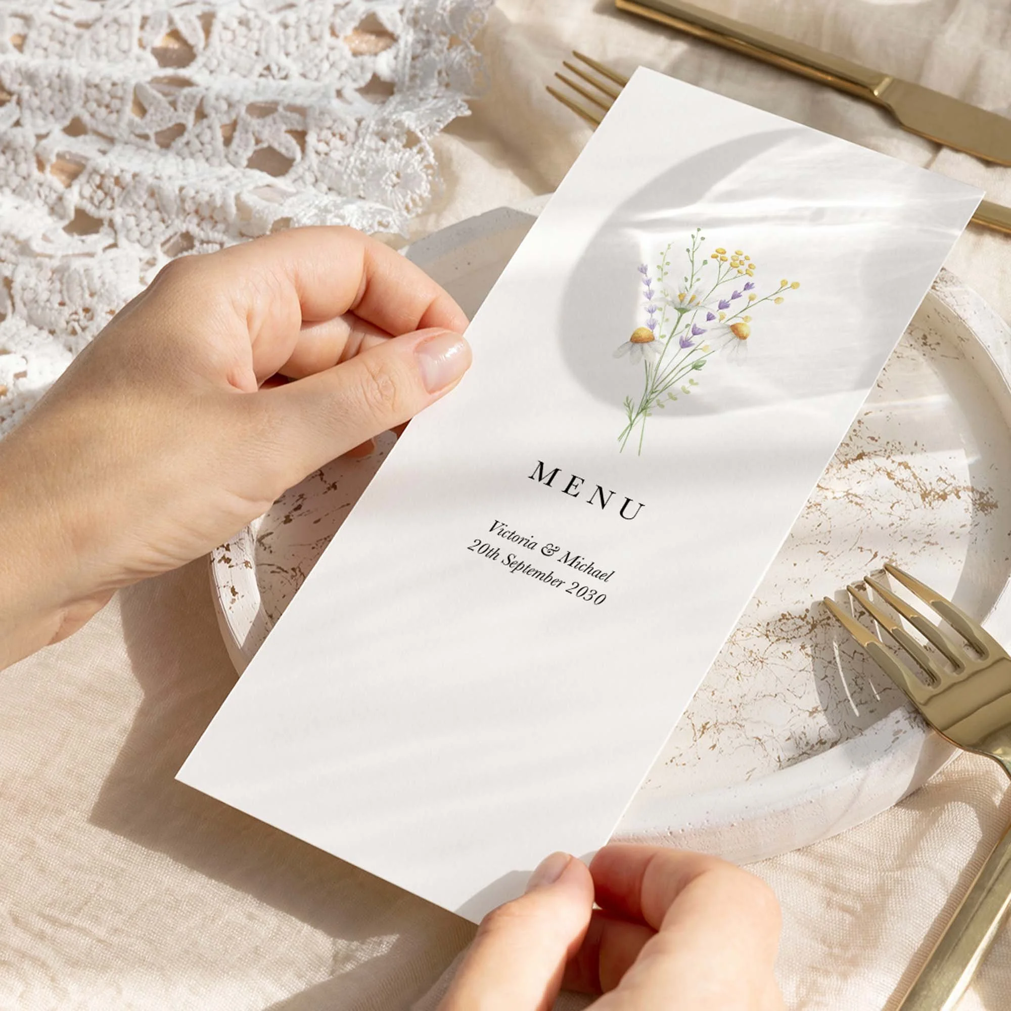 Hand holding Simple Daisy wedding menu card showing size and printed design details