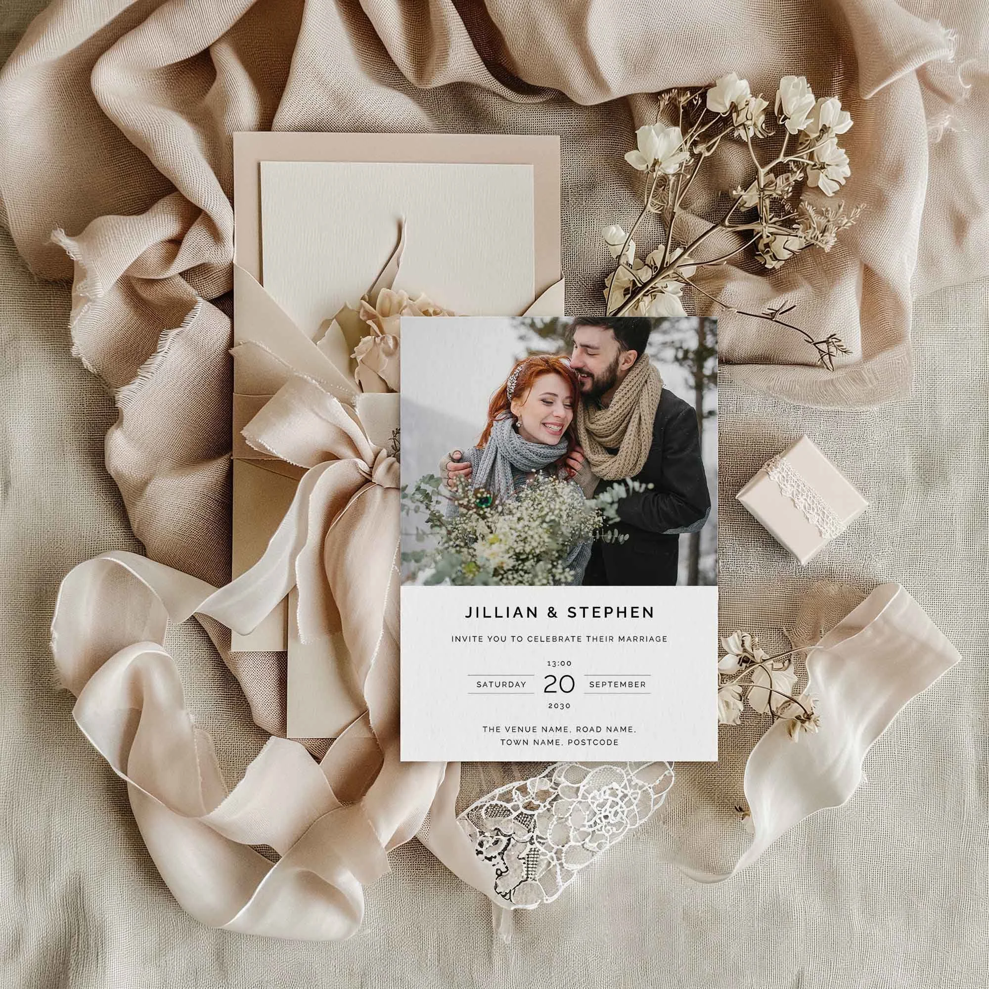 Photograph wedding invitation styled in a flat lay environment with wedding props