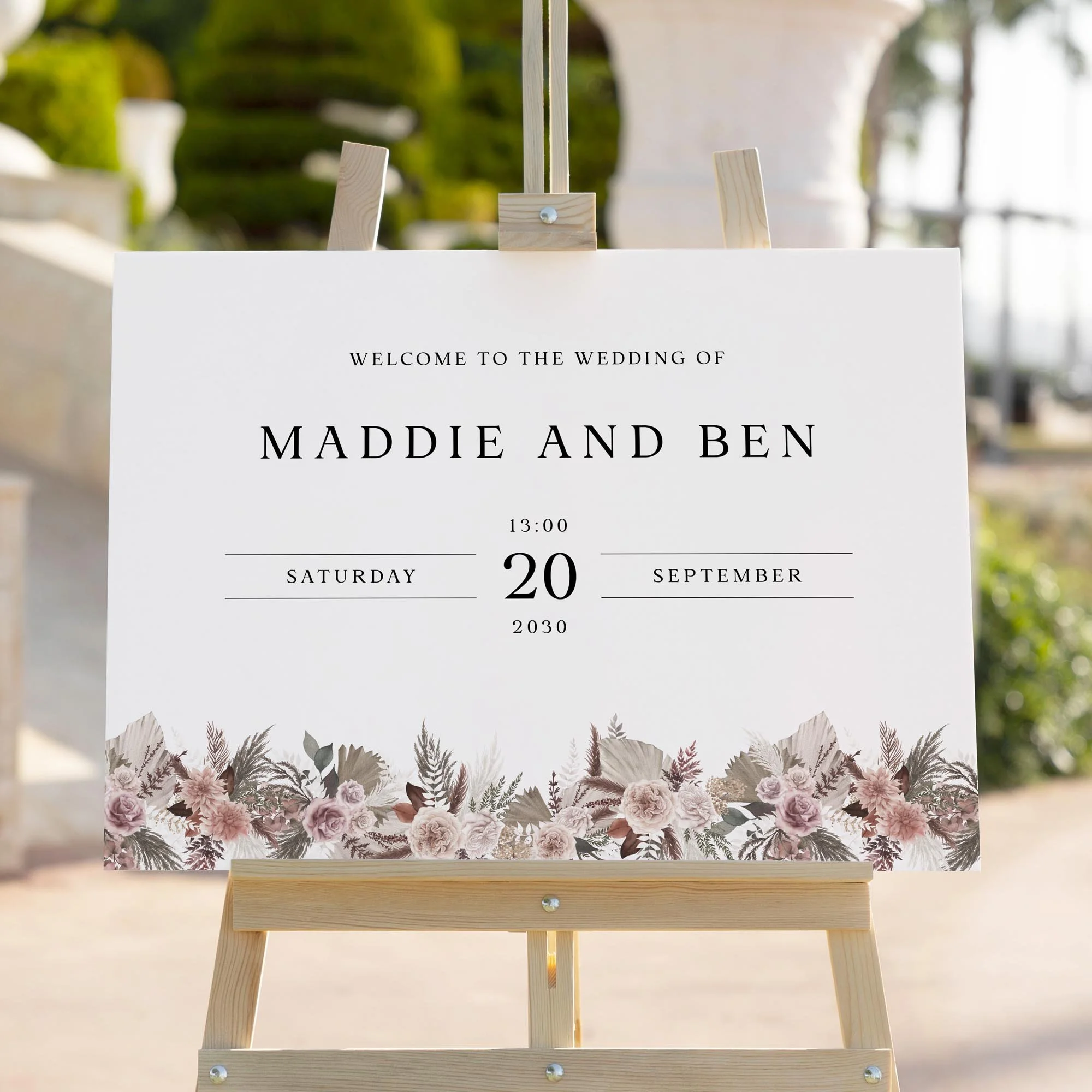 Pink Boho wedding welcome sign styled outdoors close-up