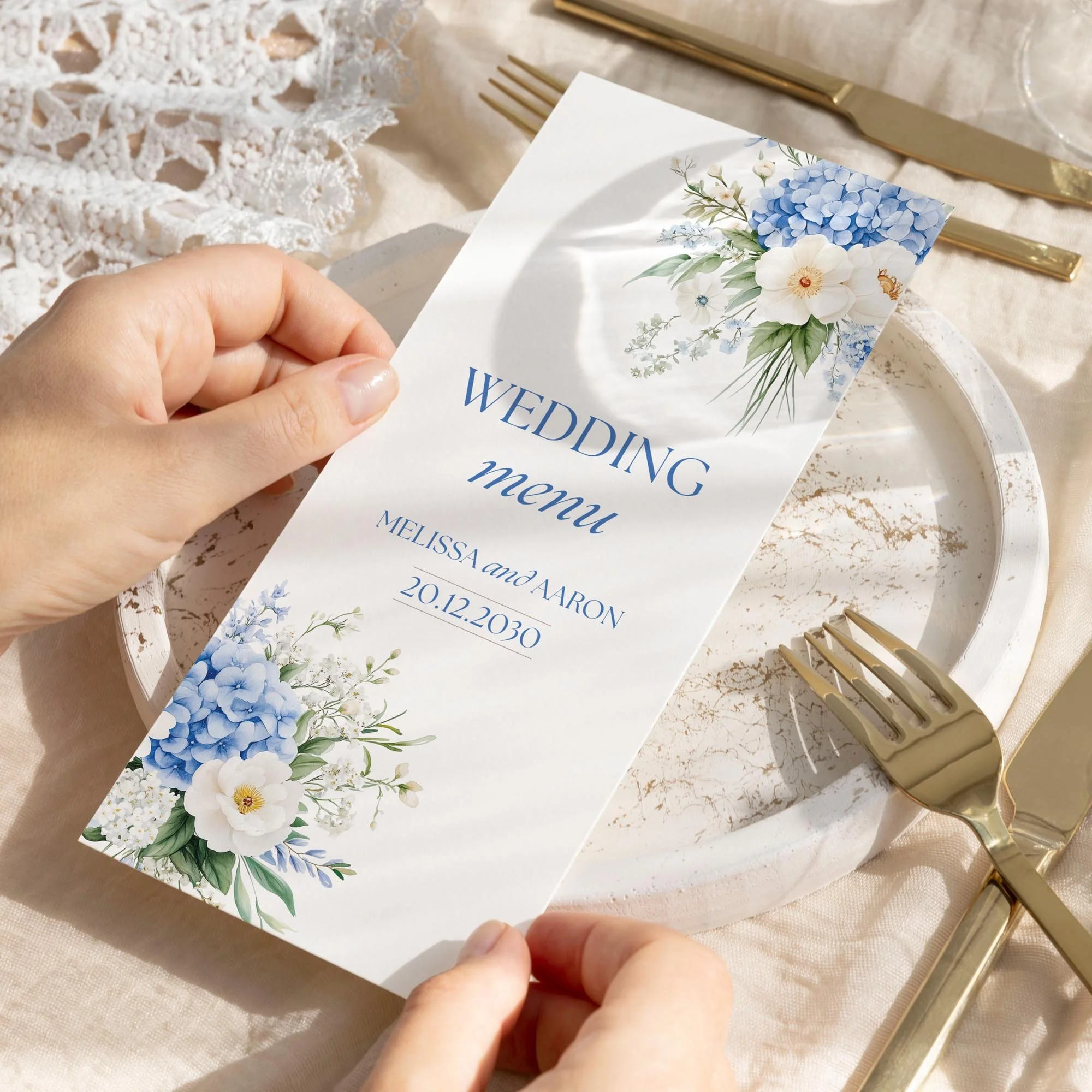 Person holding the Serenity Wedding Menu featuring elegant corner floral design.