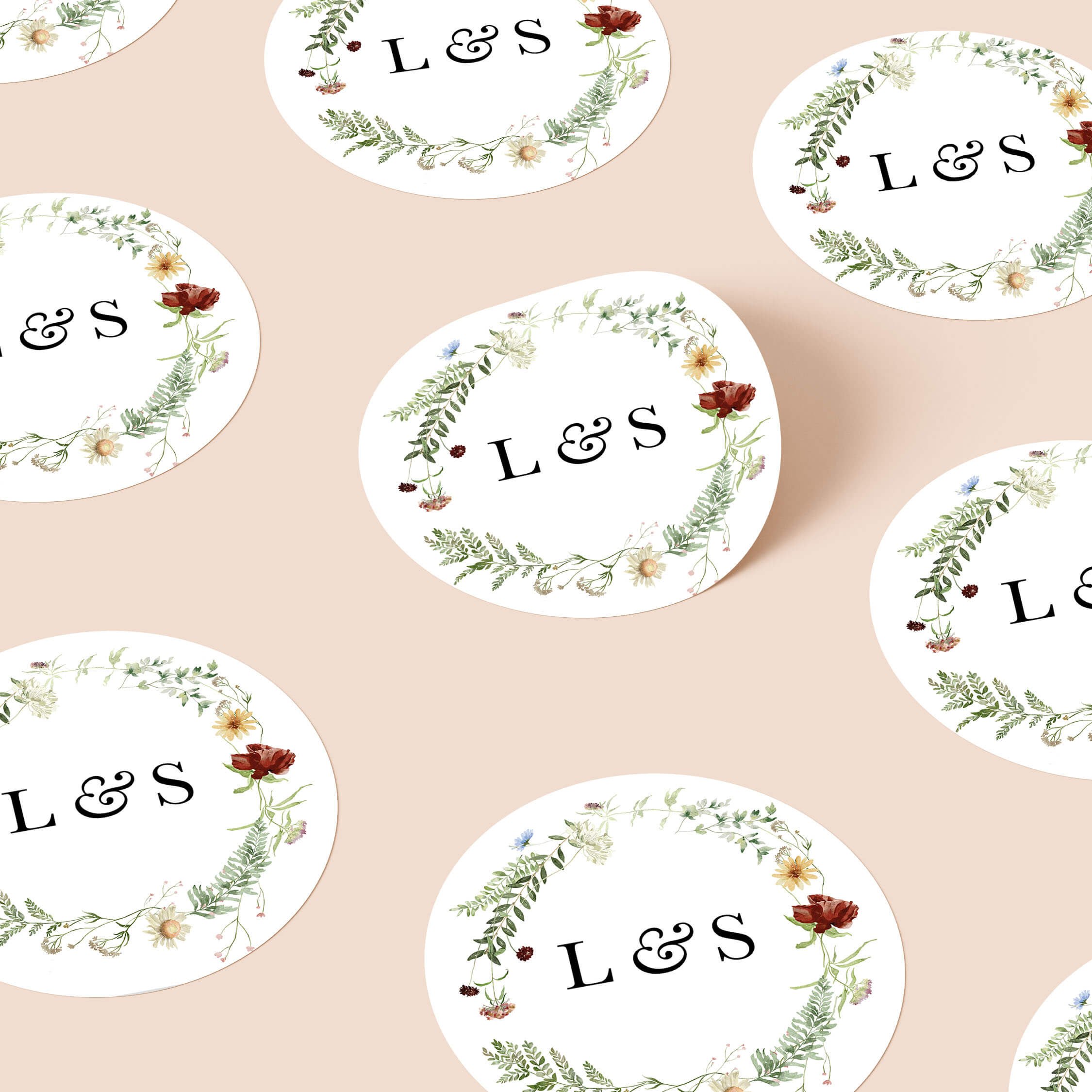 Meadow personalised wedding stickers with wildflower botanical wreath and elegant initials on round stickers