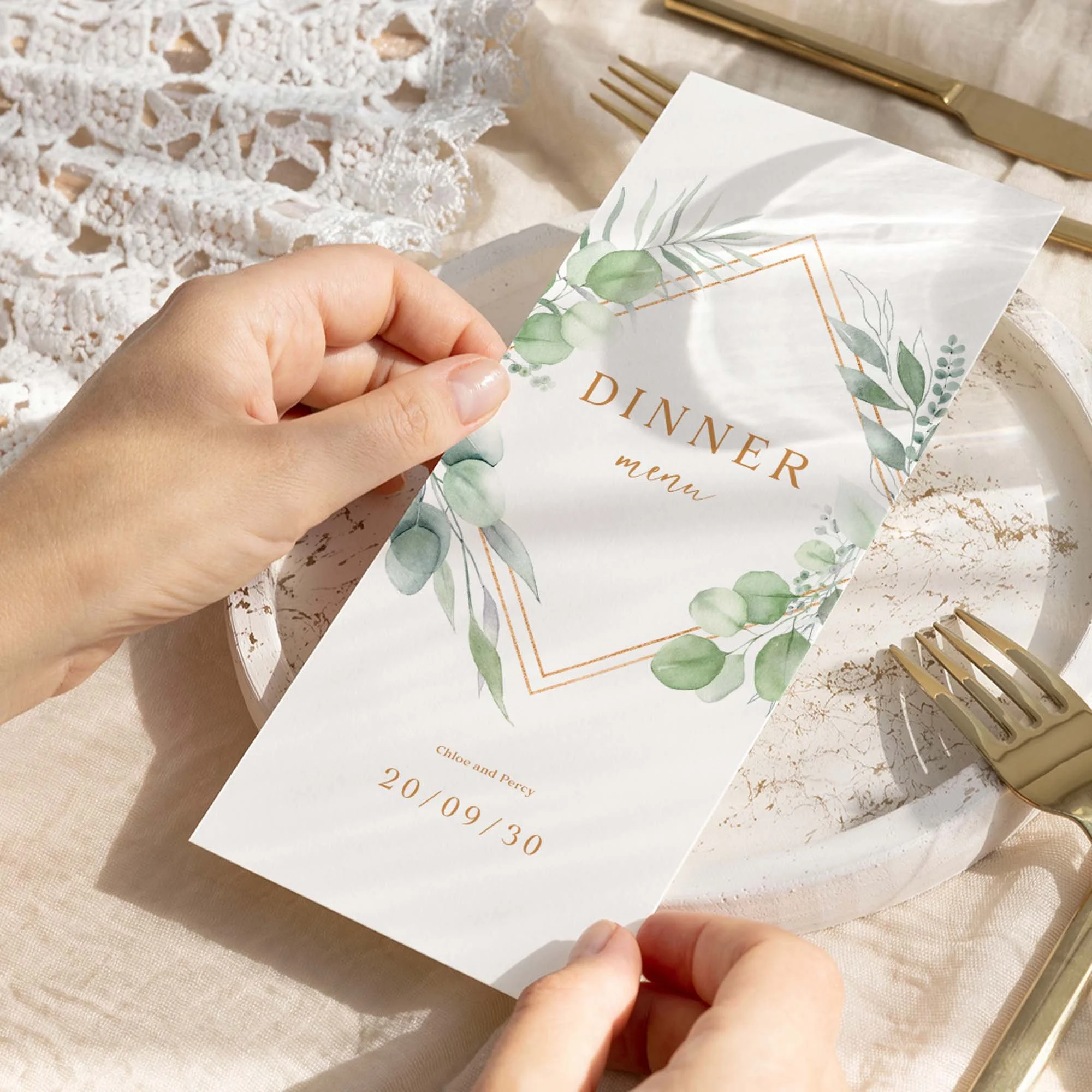 Hand holding Eucalyptus Frame wedding menu card showing size and printed design details