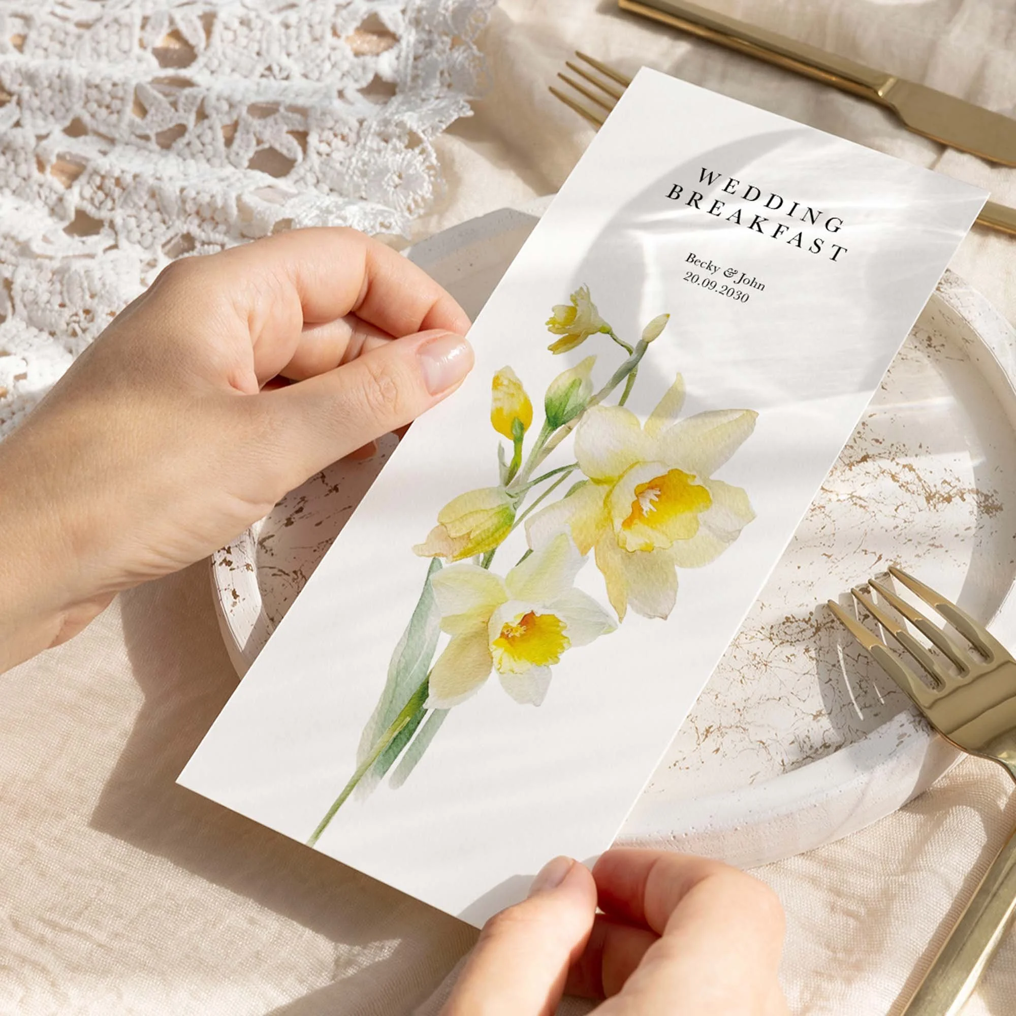 Hand holding Daffodil wedding menu card showing size and printed design details