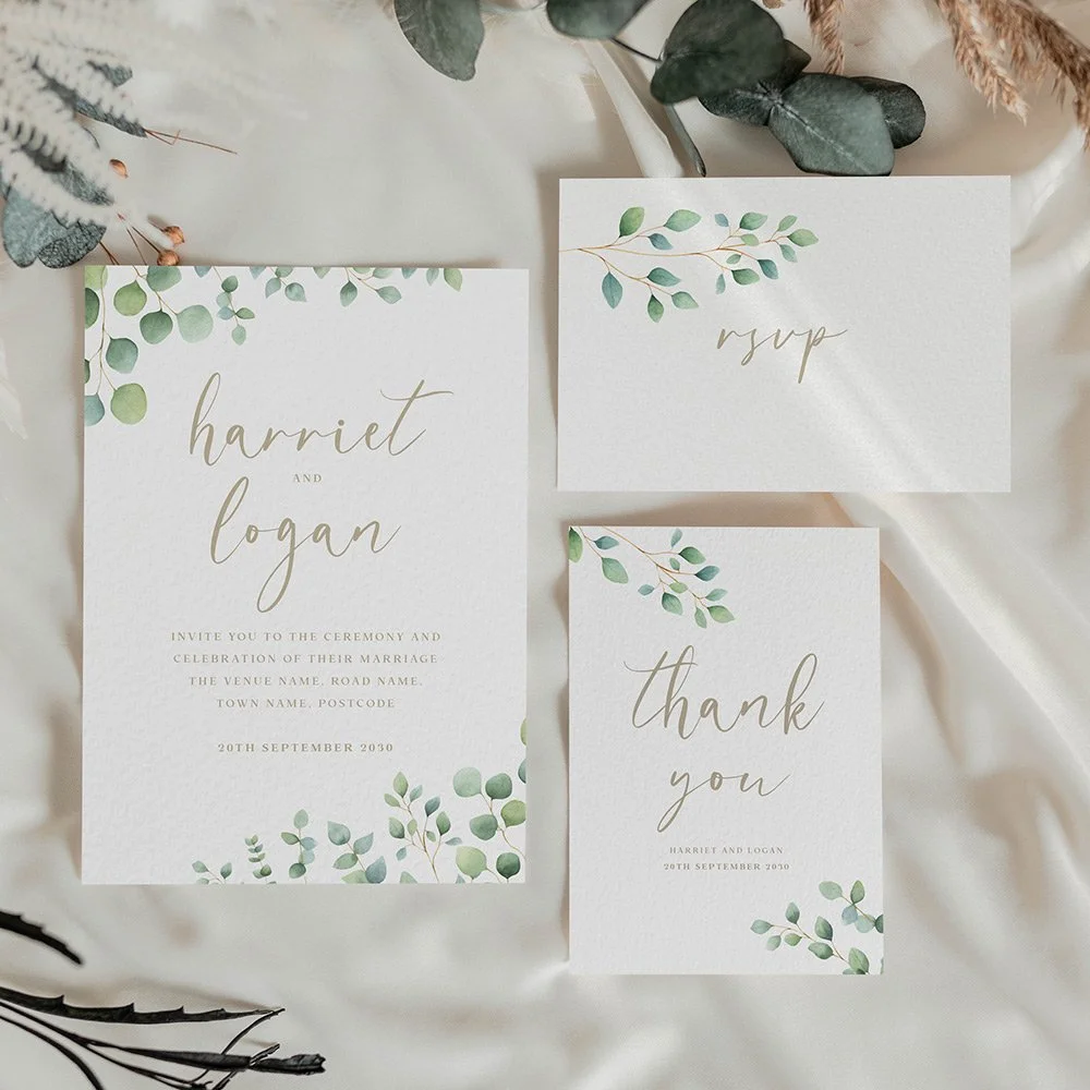 Eucalyptus wedding stationery with hanging green leaves from the top, gold typography, and modern calligraphy detailing.