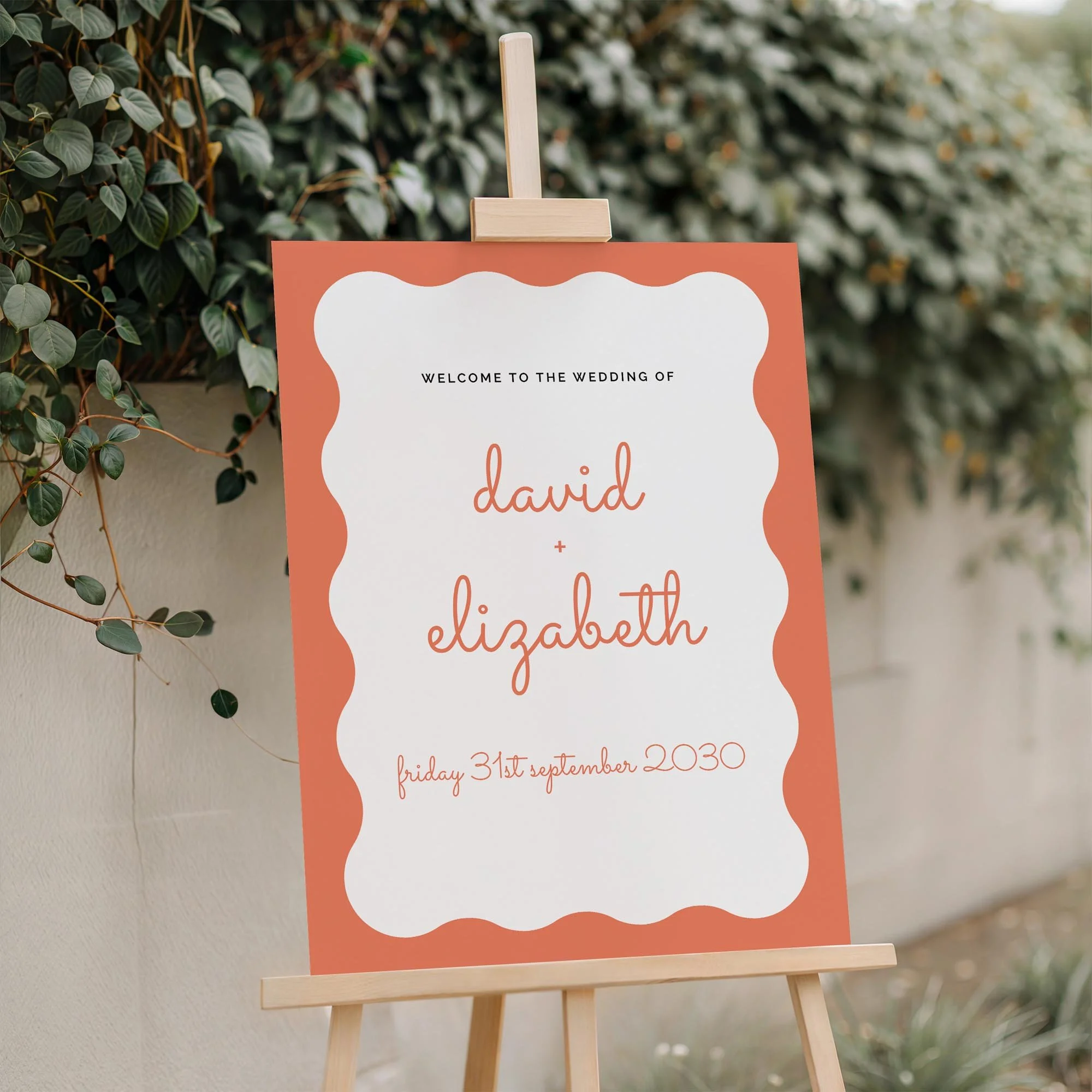 Close-up of the Scallop wedding Welcome Sign board displayed outdoors