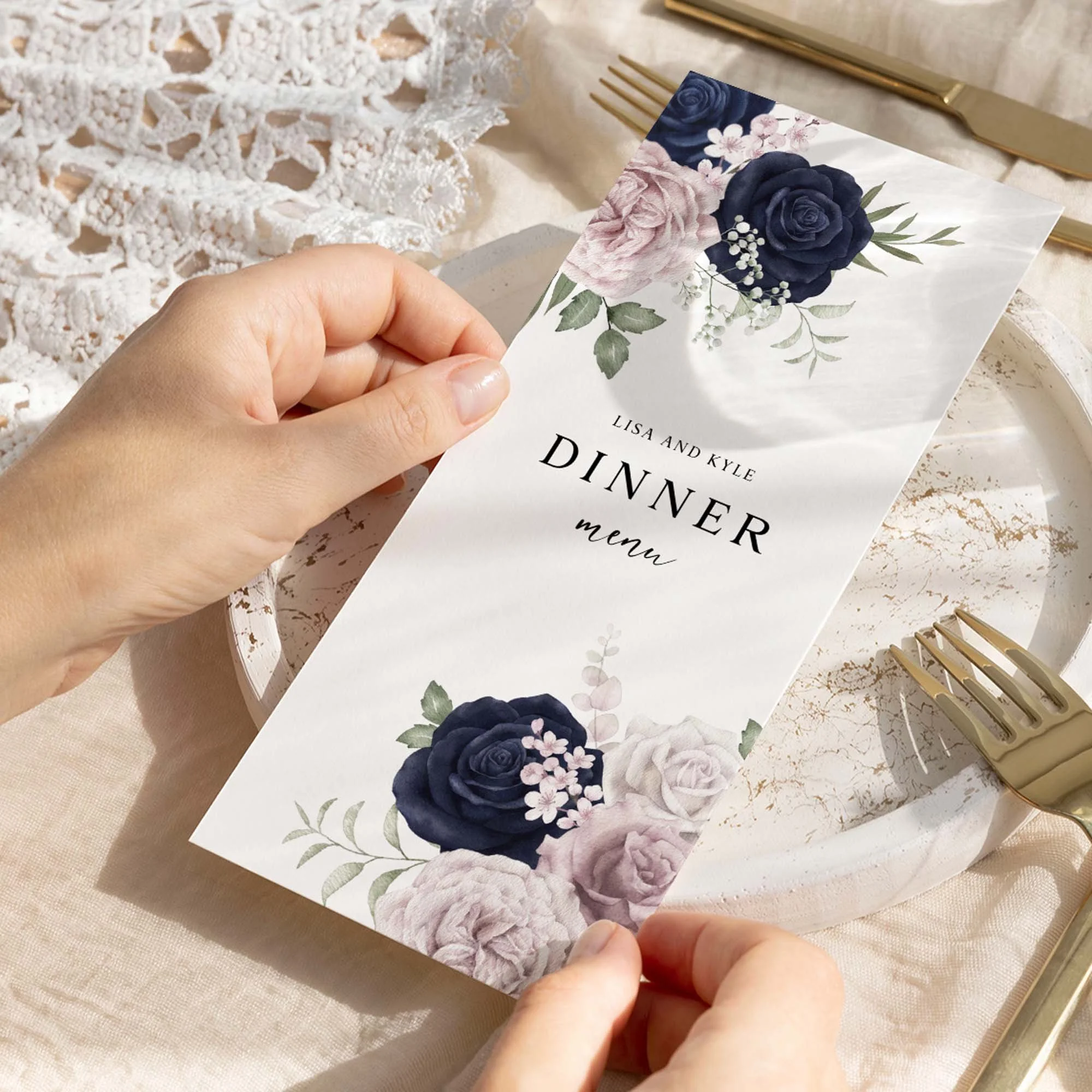 Hand holding Navy and Blush Floral wedding menu card showing size and printed design details