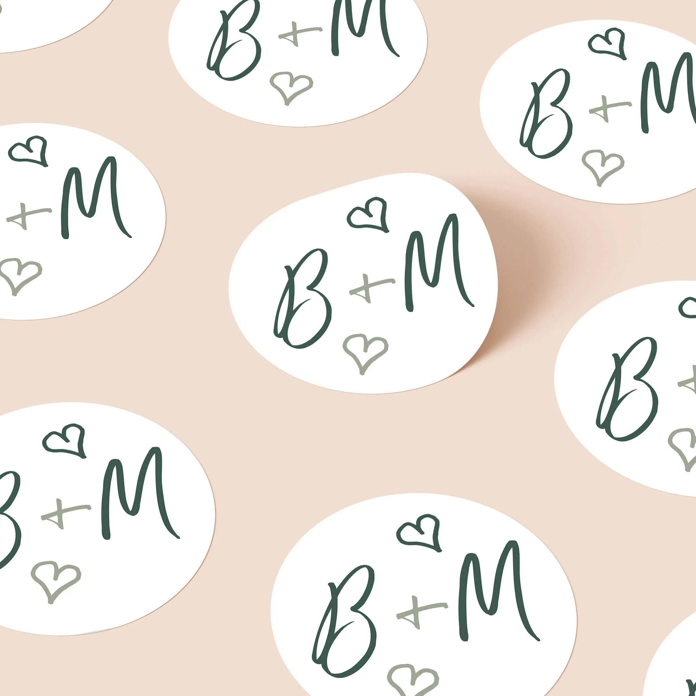 Whimsical Green personalised wedding stickers with forest green script initials and heart details on round white stickers