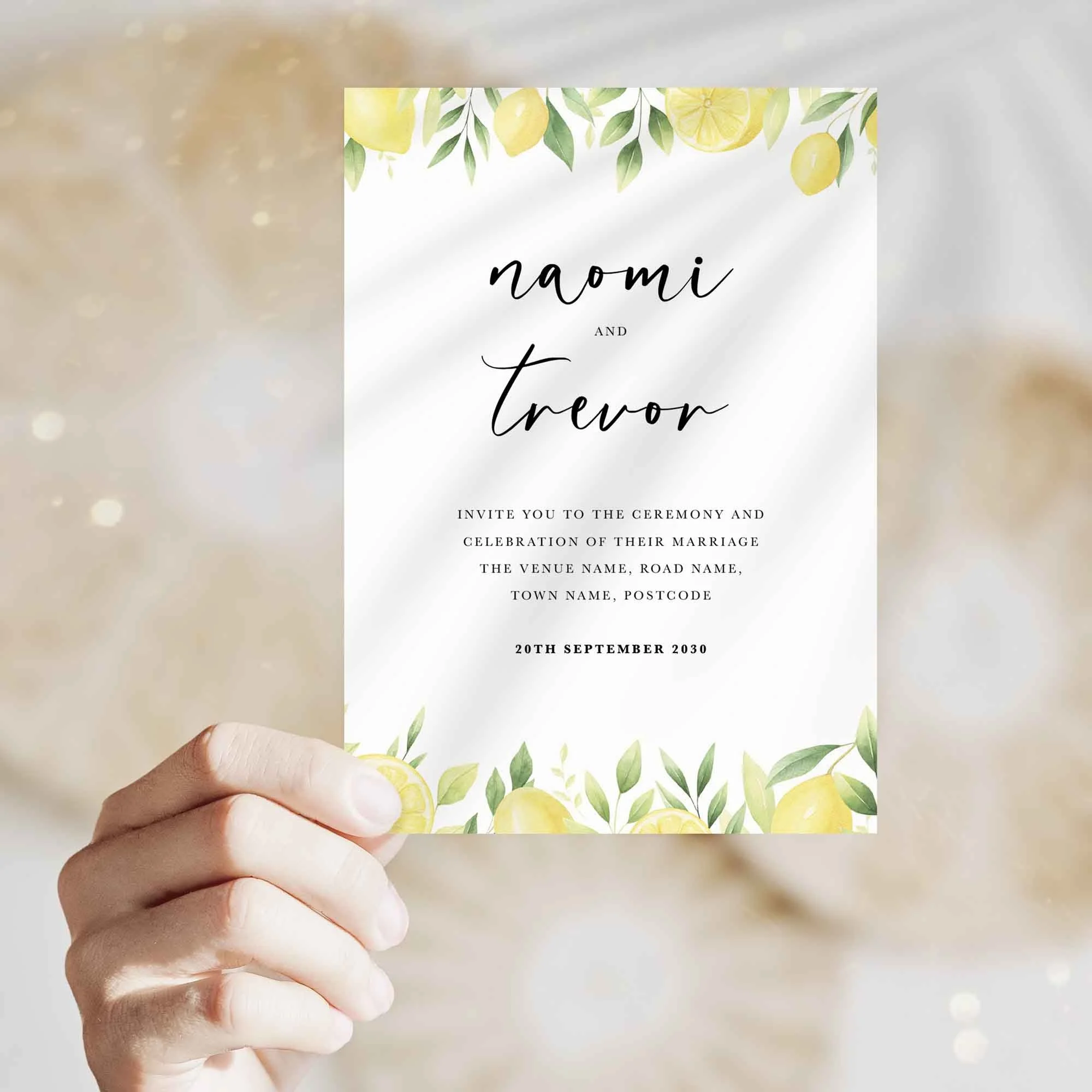 Hand holding Lemon wedding invitation showing size and printed design details