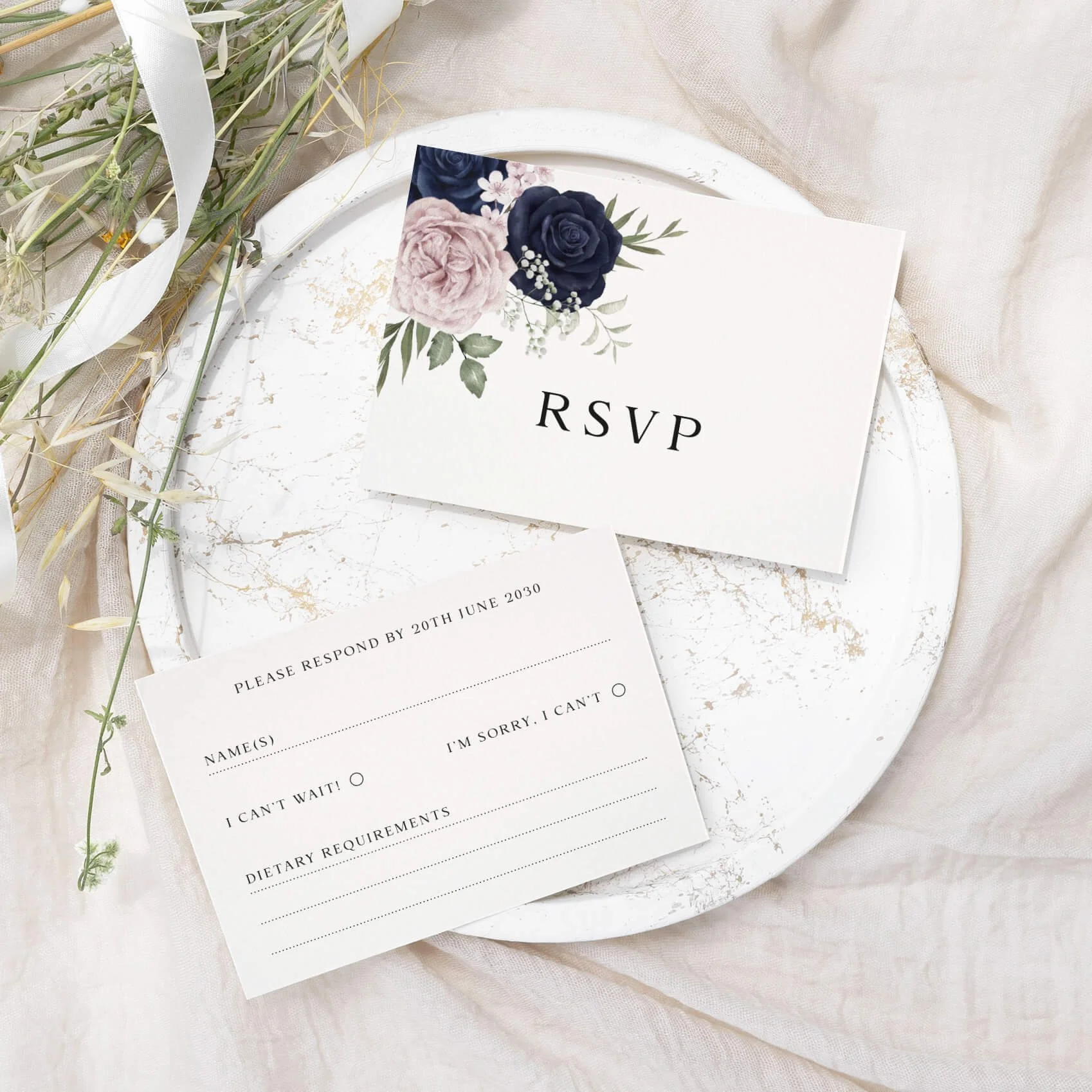 Navy and blush wedding RSVP card with watercolour navy and pink rose floral arrangement on luxury off-white card