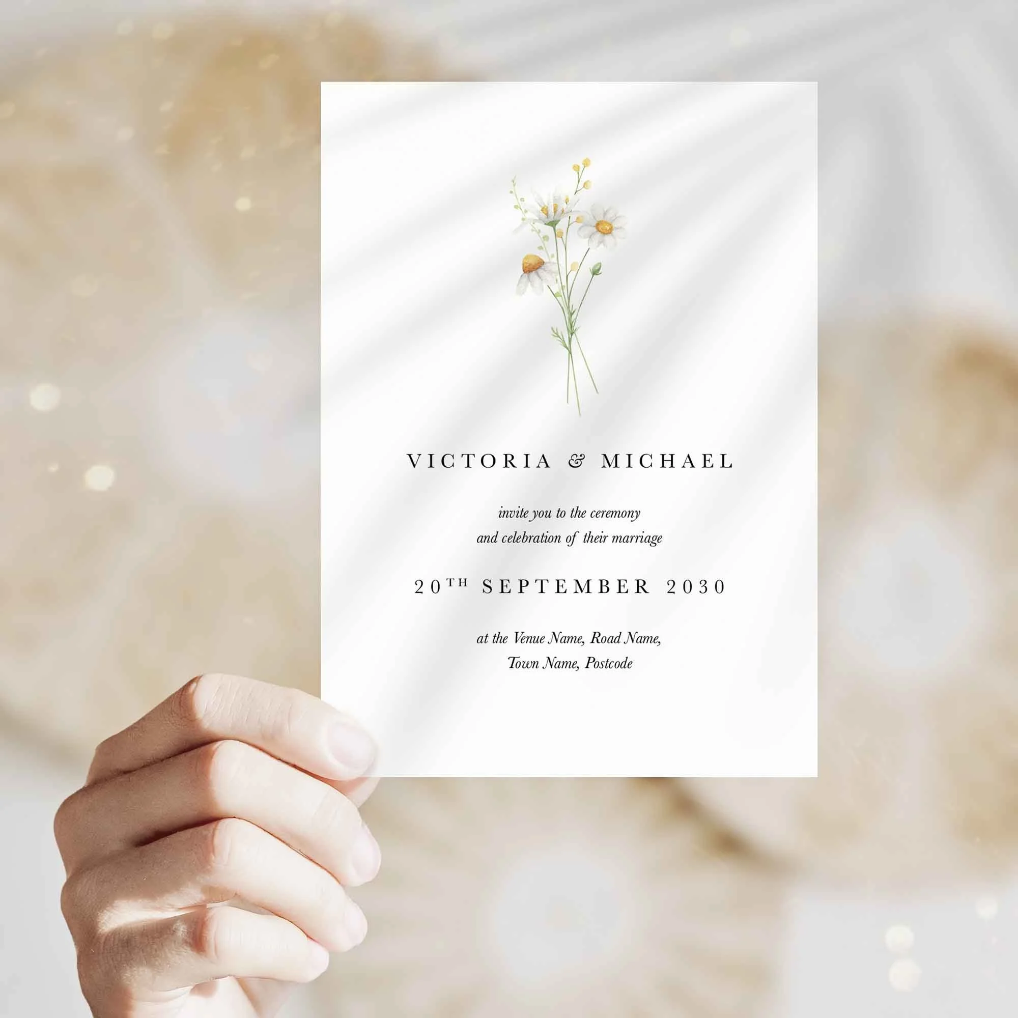 Hand holding Daisy wedding invitation showing size and printed design details