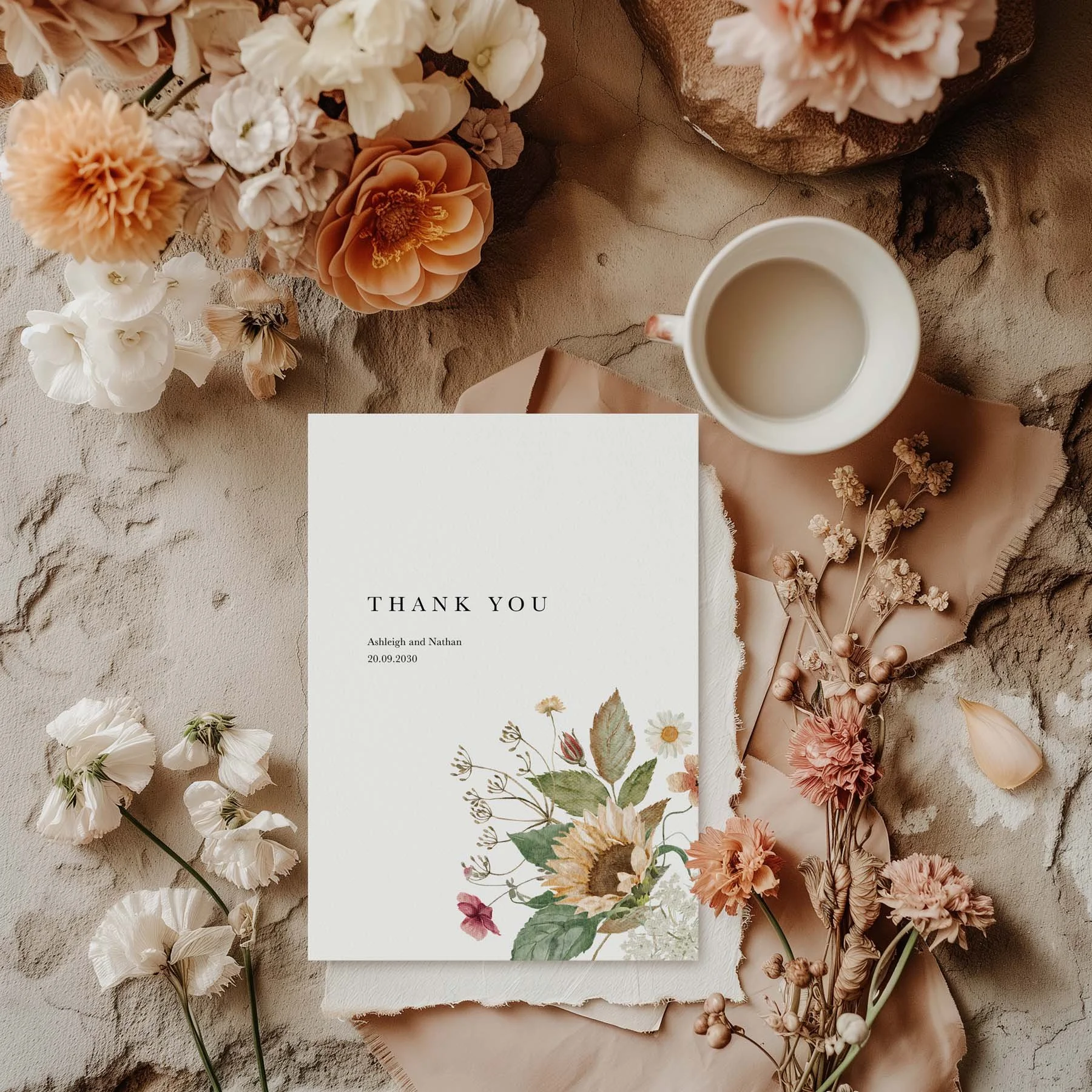 Autumn Sunflower wedding thank you card with a sunflower and wildflower bouquet design, styled with dried flowers and a white cup on a neutral background