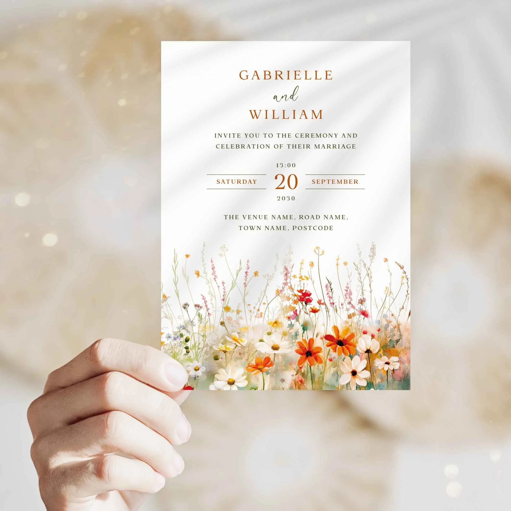 Hand holding Field Vermilion wedding invitation showing size and printed design details