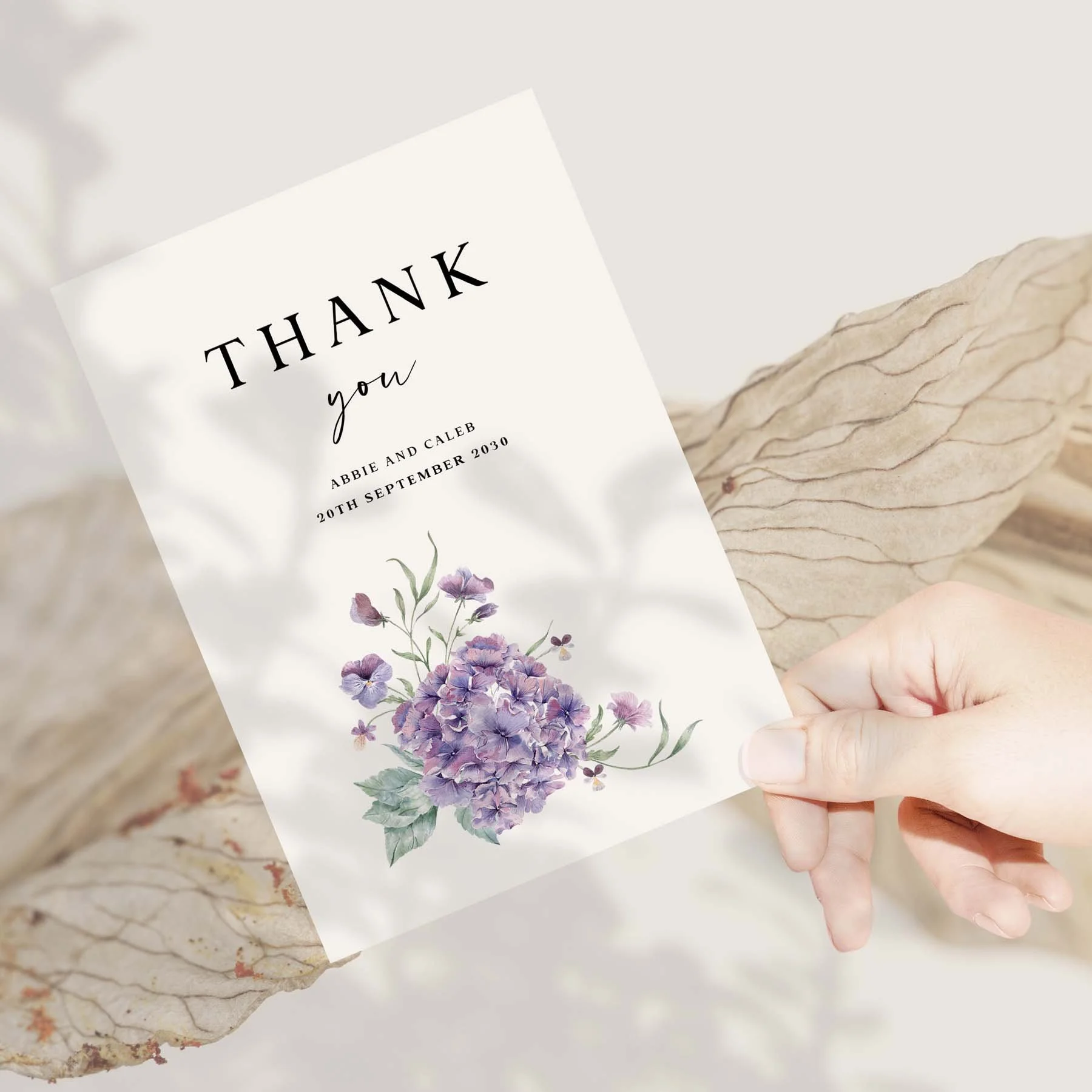 Hand holding a Purple Hydrangea wedding thank you card