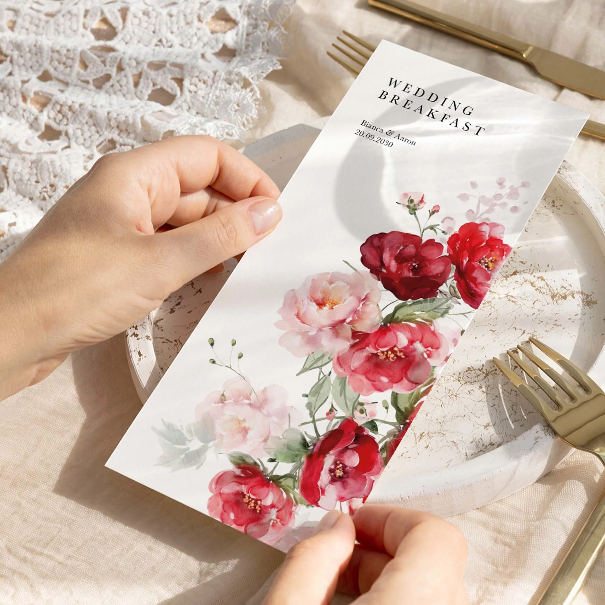 Hand holding Red Floral wedding menu card showing size and printed design details