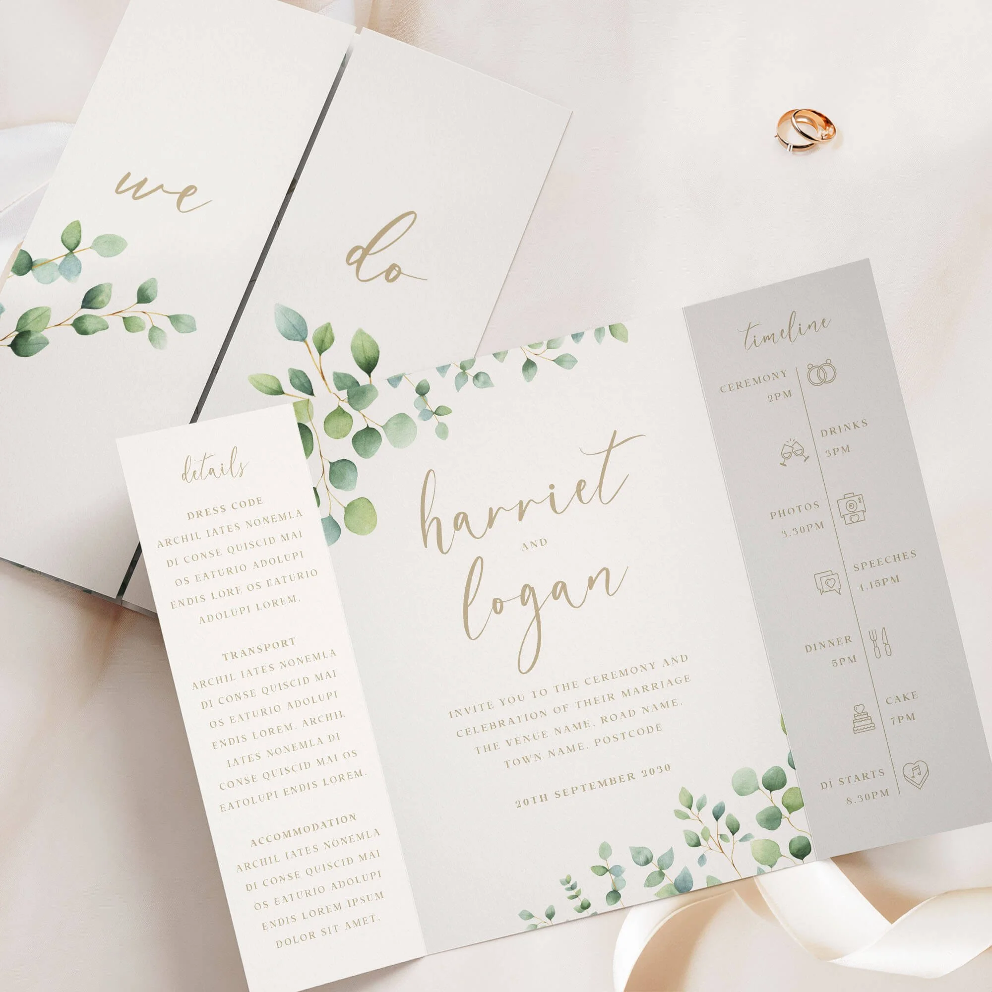 Eucalyptus gatefold wedding invitation with calligraphy script names and gold sage green foliage