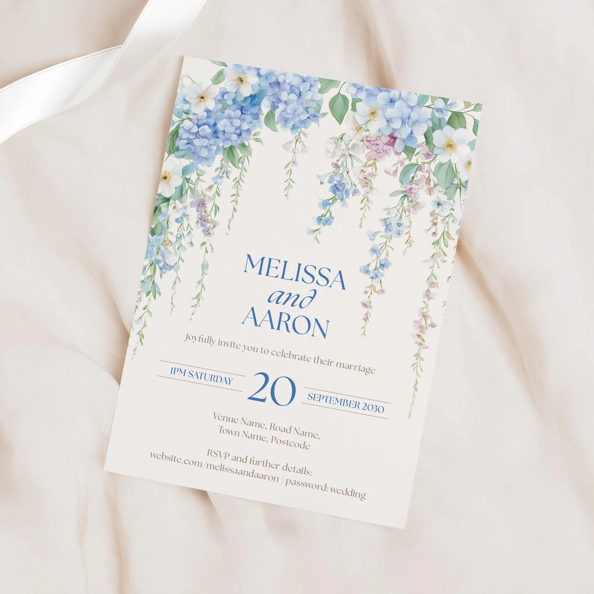 Minimal product shot of the Serenity Wedding Invitation with cascading blue florals.