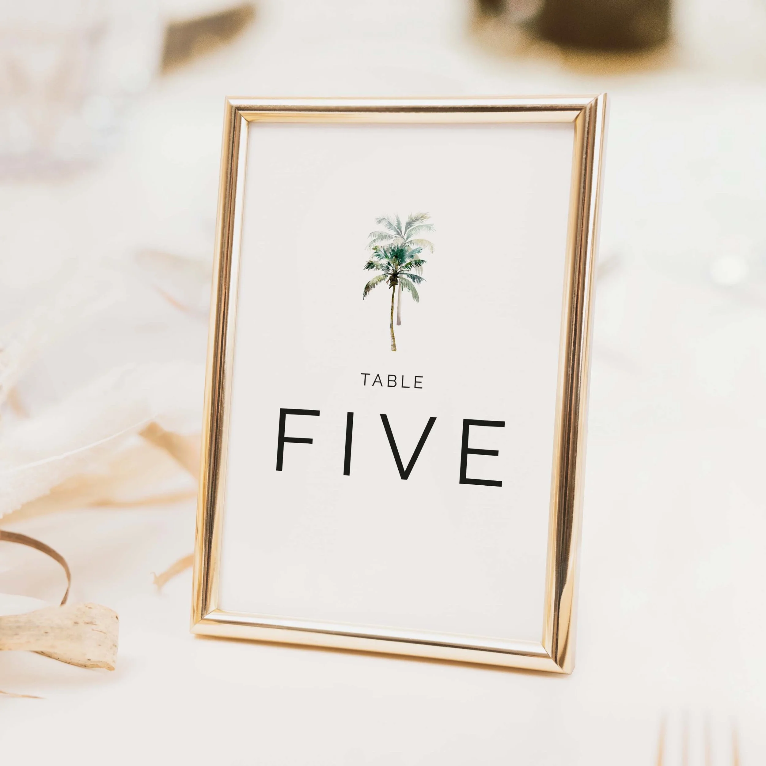 Palm Tree wedding table number with tropical palm tree illustration and bold clean typography on luxury off-white card