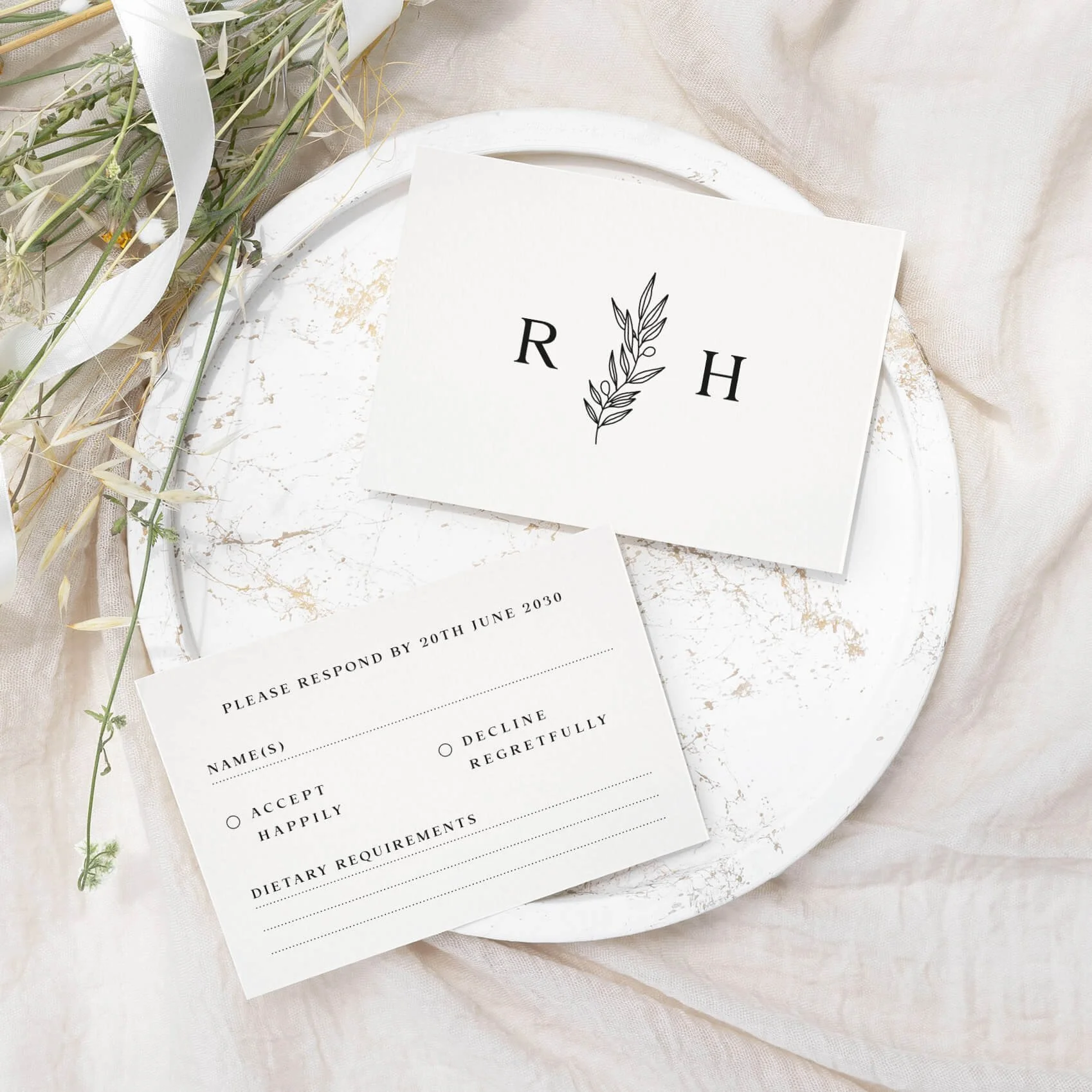 Heritage wedding RSVP card with couples monogram initial crest and botanical line art on luxury off-white card