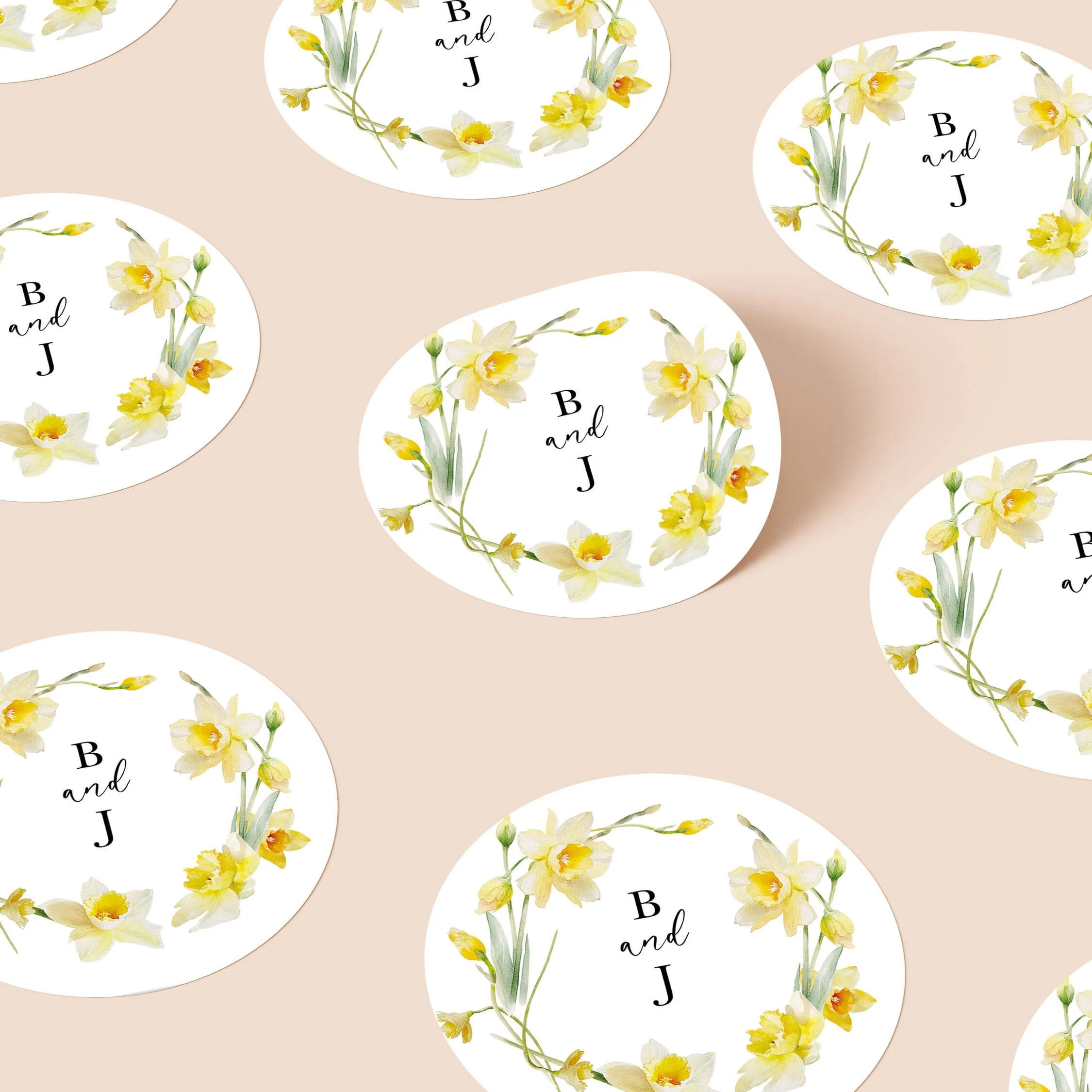 Daffodil wedding stickers with yellow floral wreath and initials repeated on personalised round seals