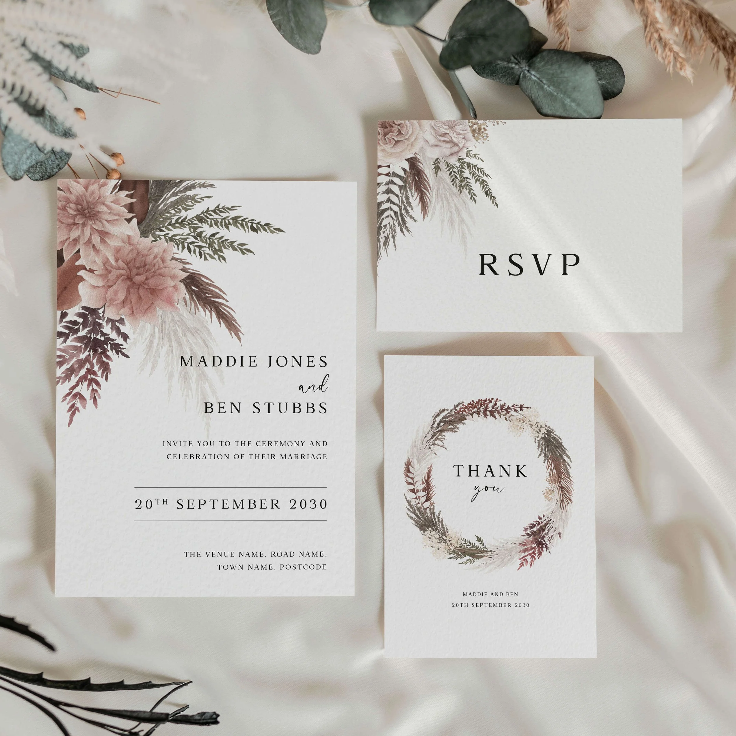 The Blush Boho wedding stationery collection featuring invitation and menu card with pampas grass and blush pink dahlia corner arrangement