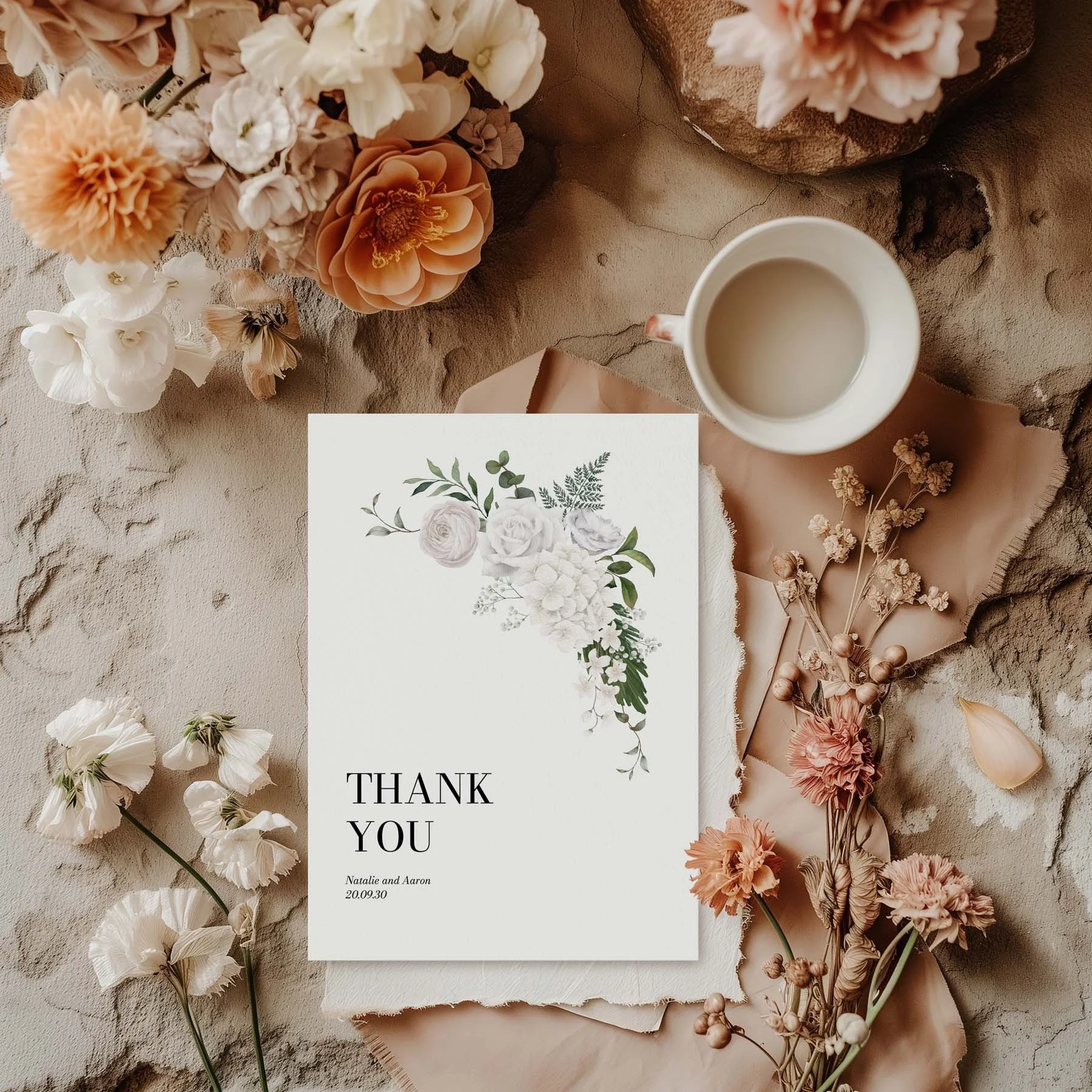 White Floral wedding thank you card styled with flowers and stationery details