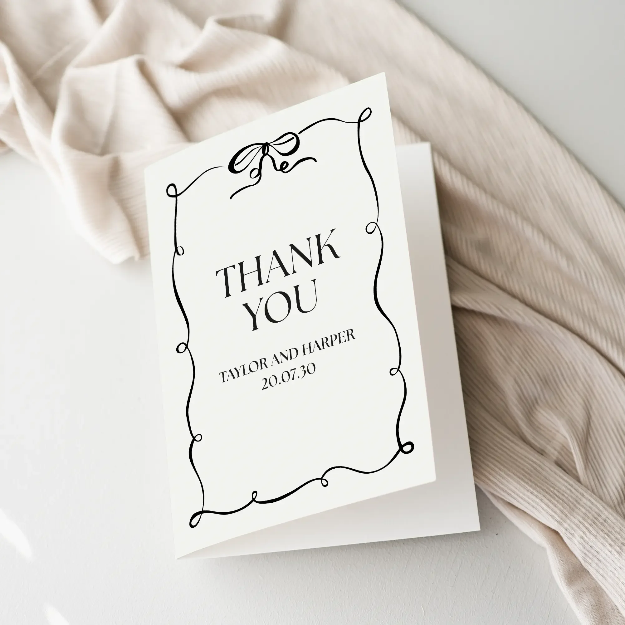 Black Tie Wedding Thank You Card with monochrome design, black bow, and border.