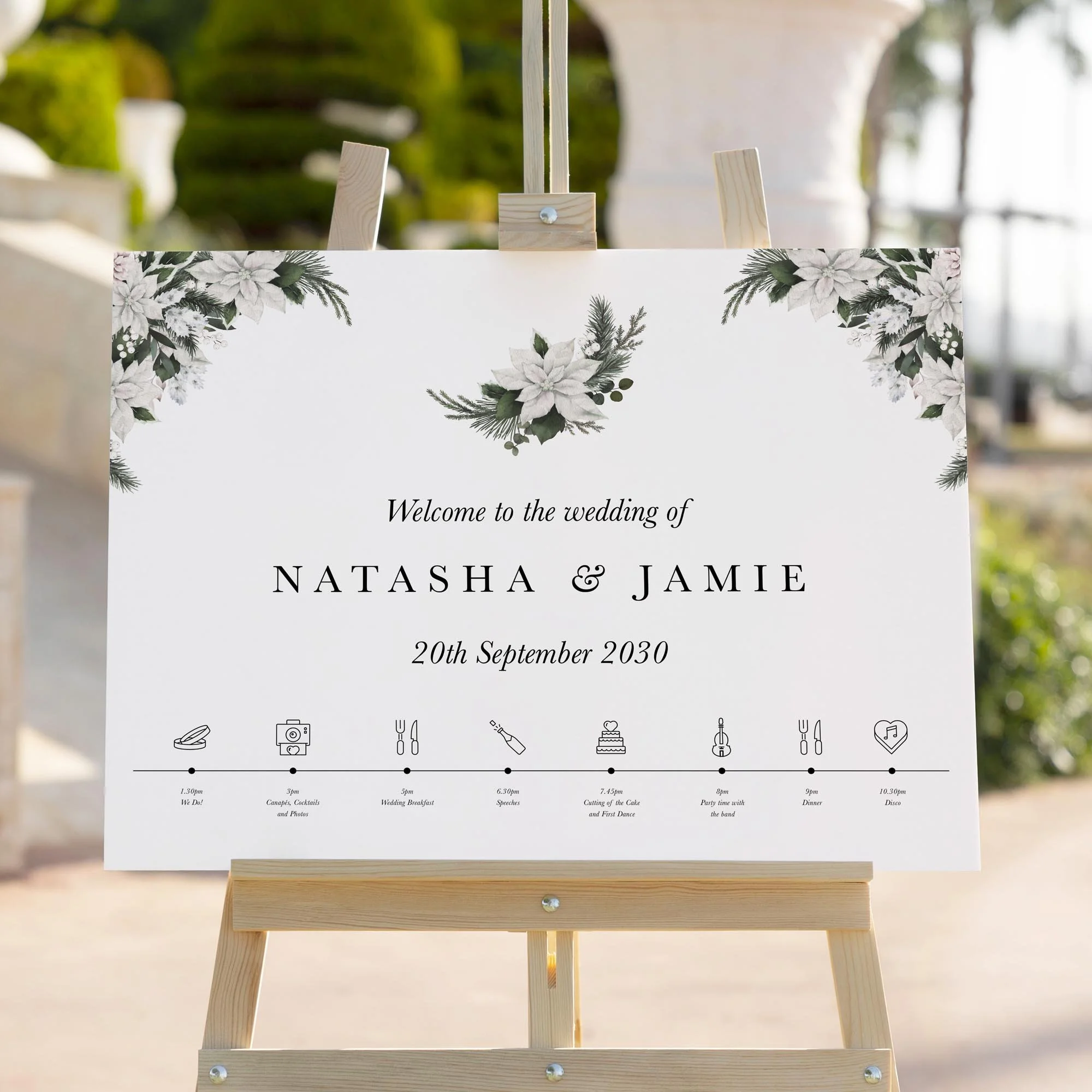 White Poinsettia Winter wedding welcome sign styled outdoors close-up