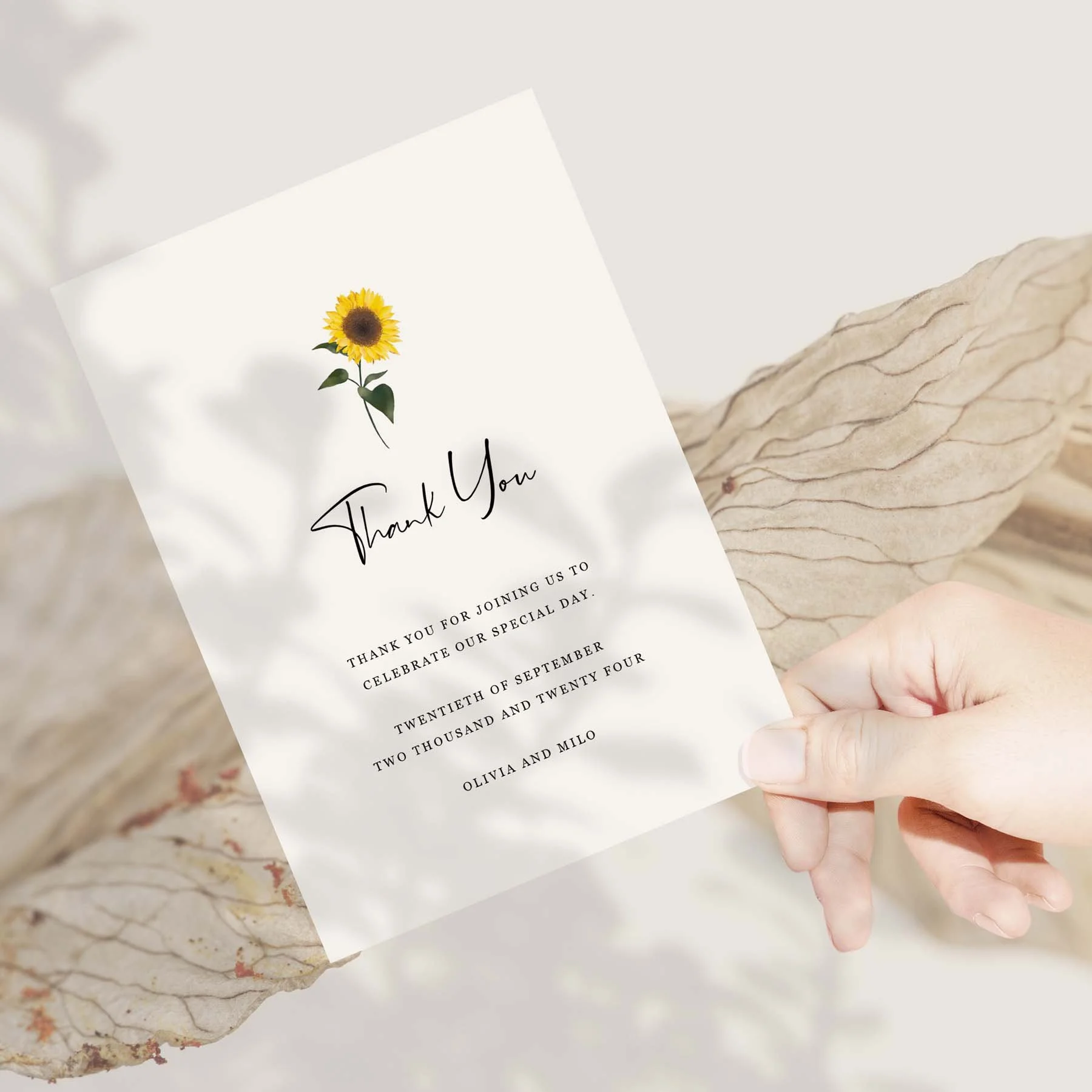 Hand holding a Simple Sunflower wedding thank you card