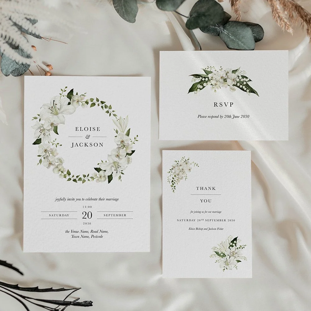 Garden Collection flat wedding invitation, RSVP card, and thank you card featuring ivory lily of the valley flowers and soft green leaves.