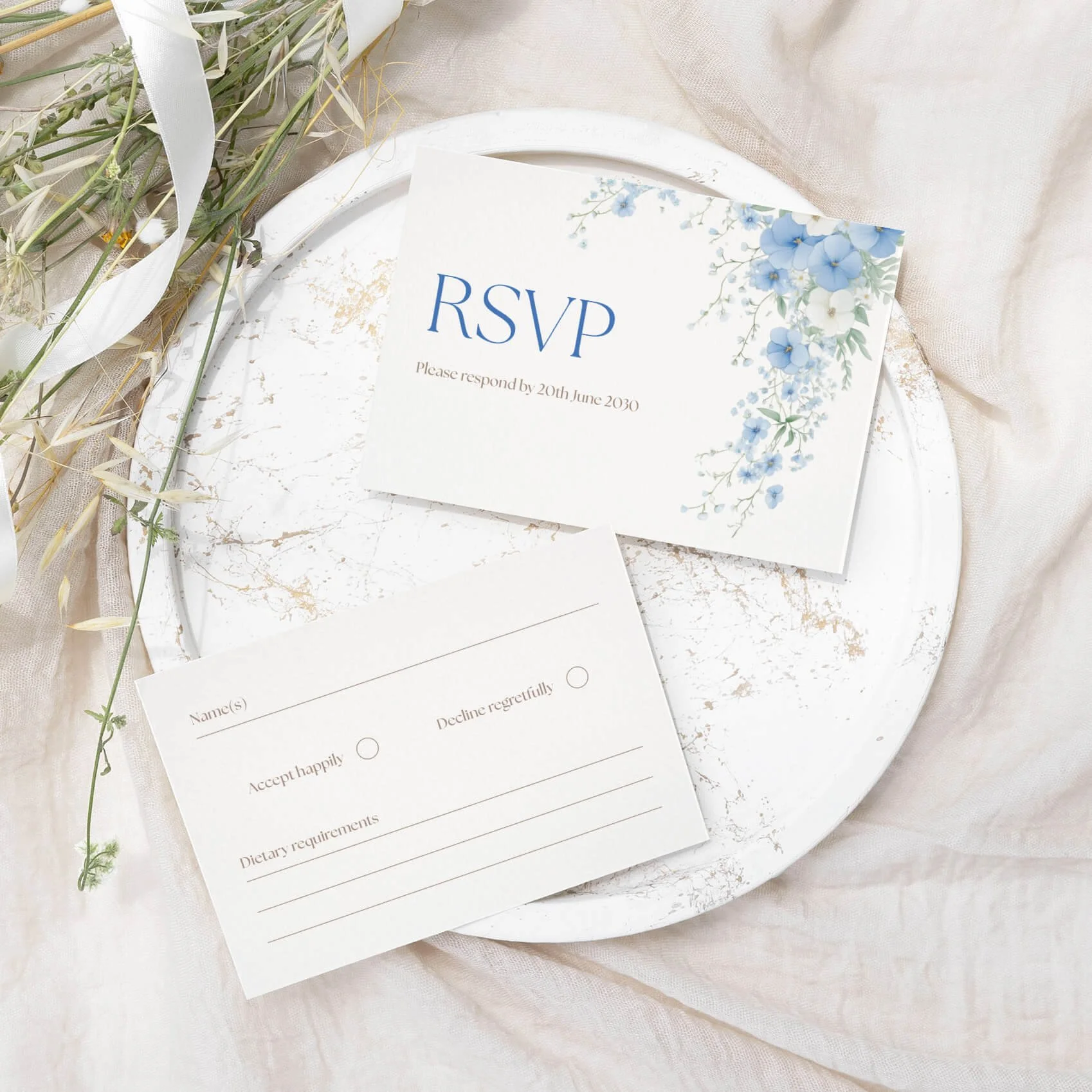 Serenity wedding RSVP card with soft blue watercolour floral illustration on luxury off-white card