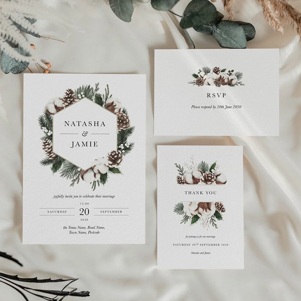 Woodland Collection wedding stationery featuring watercolour pine cones, pine leaves, snow accents, and elegant serif typography in sage and forest green