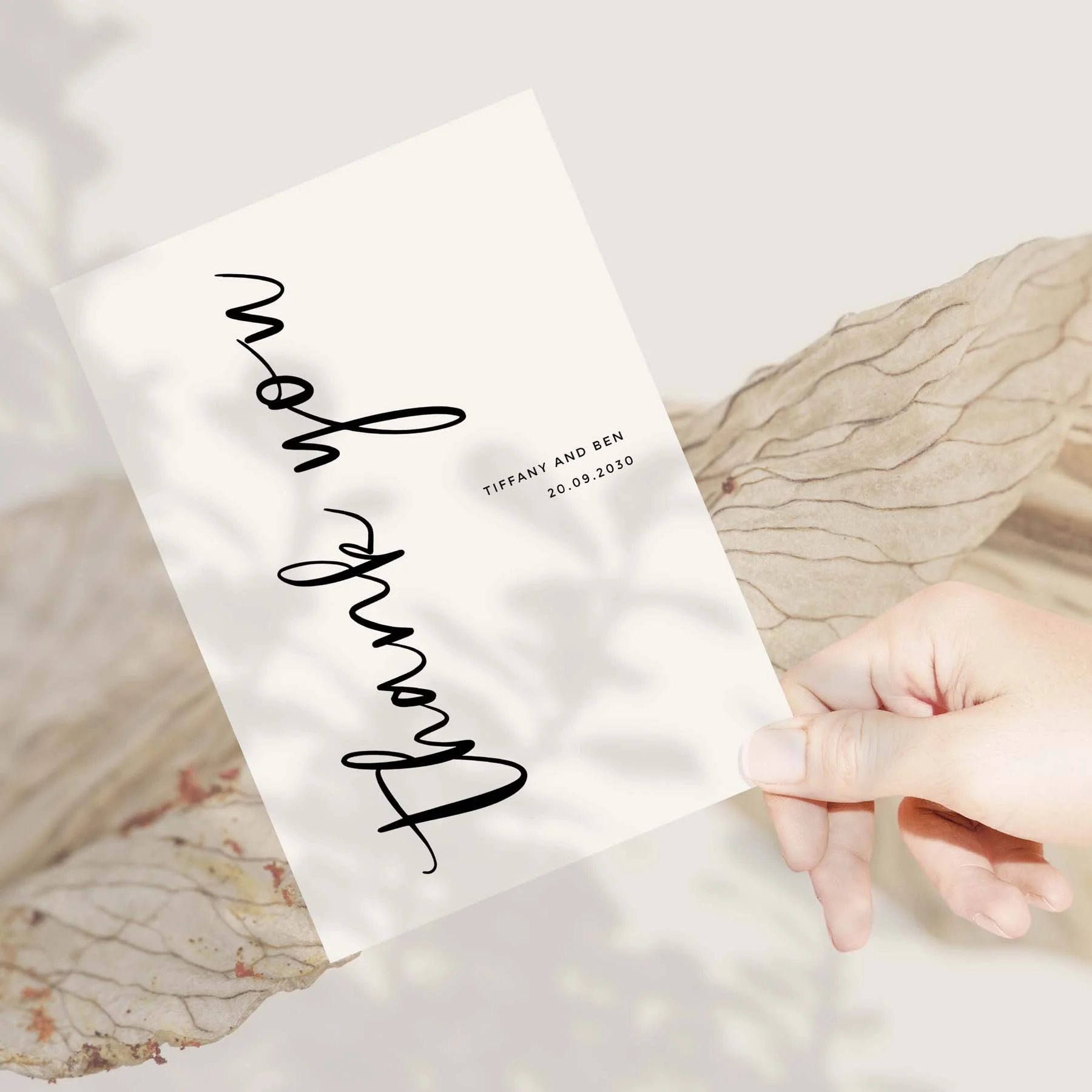 Hand holding a Vertical Text wedding thank you card