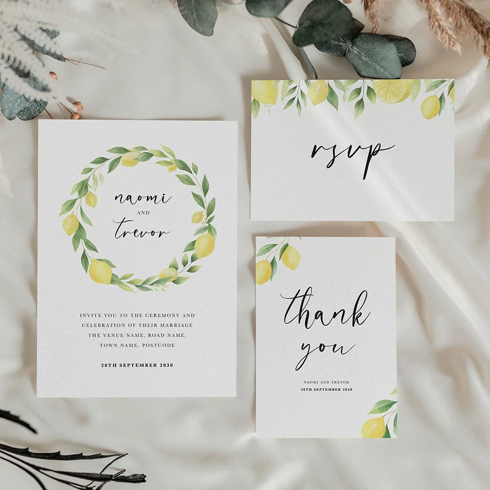 Lemon Collection wedding stationery set including flat wedding invitation, RSVP card, and thank you card with citrus wreath design and summery colour palette.