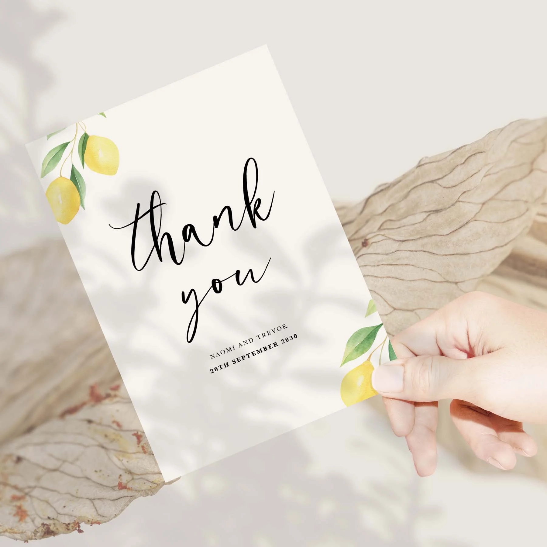 Hand holding a lemon design wedding thank you card