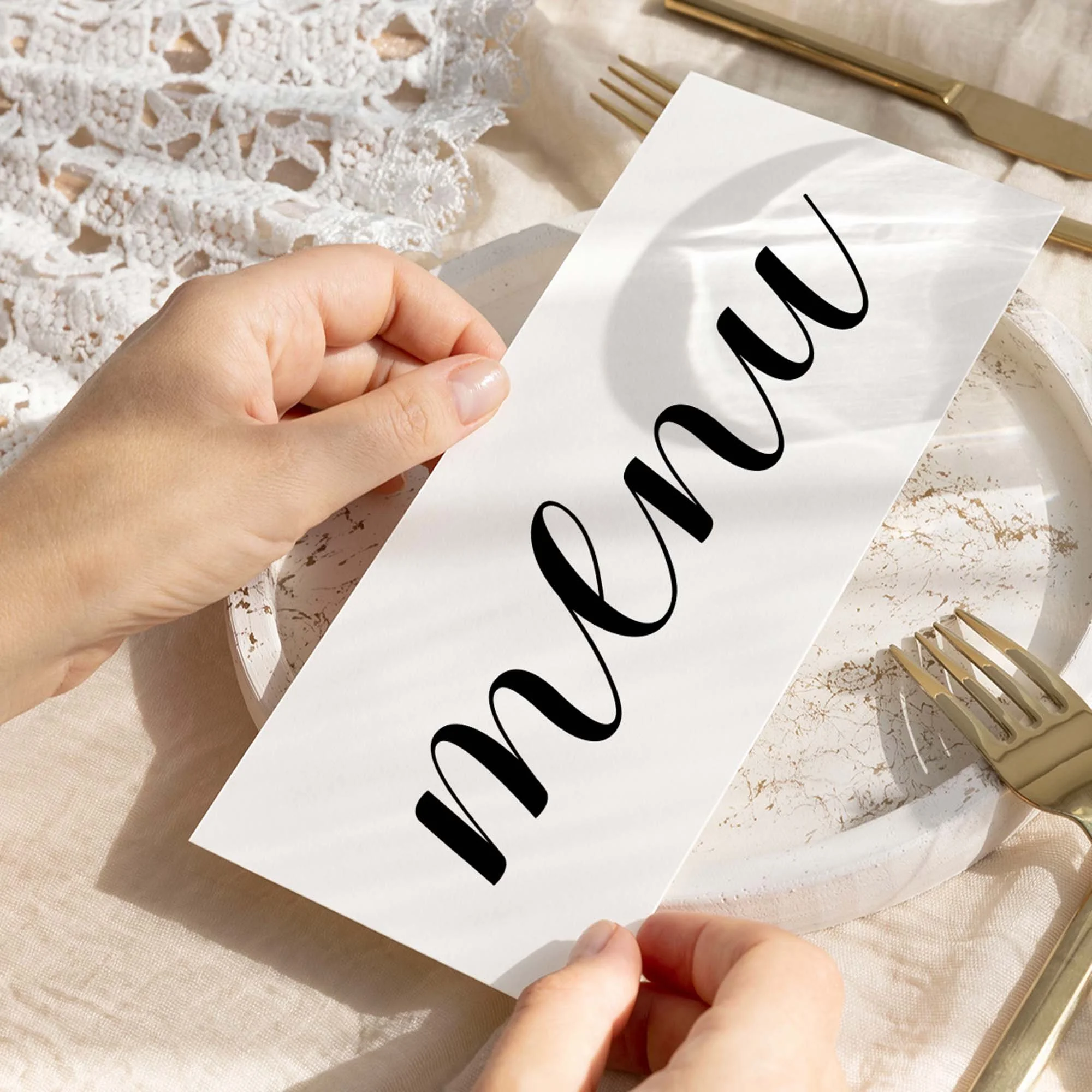 Hand holding Calligraphy wedding menu card showing size and printed design details