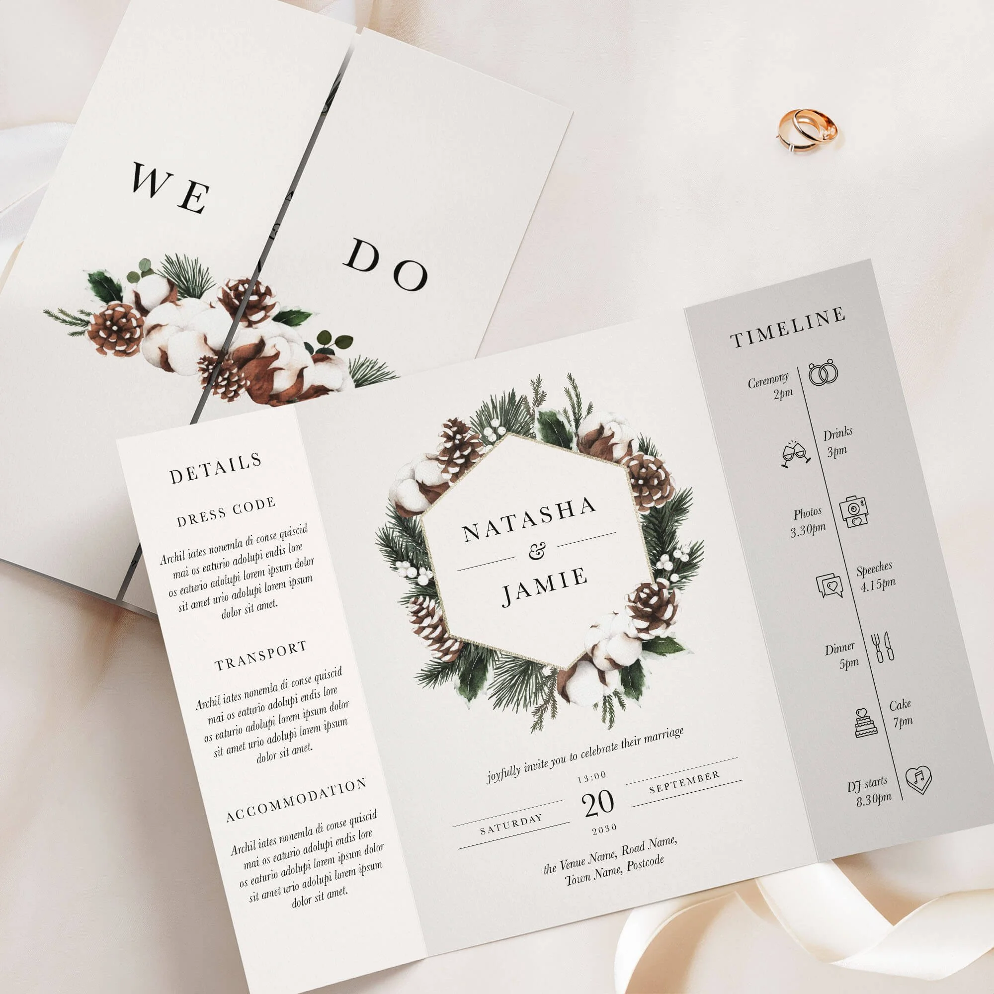 Woodland gatefold wedding invitation with pinecones, cotton and dark botanical foliage wreath