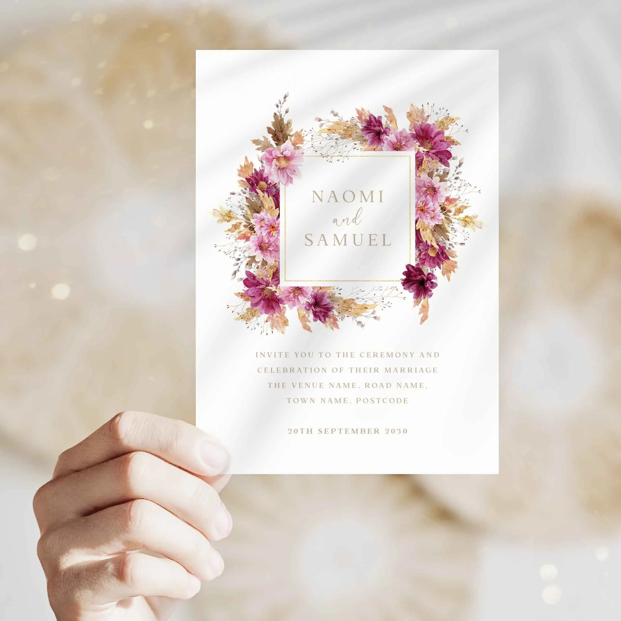 Hand holding Pink Chrysanthemum wedding invitation showing size and printed design details