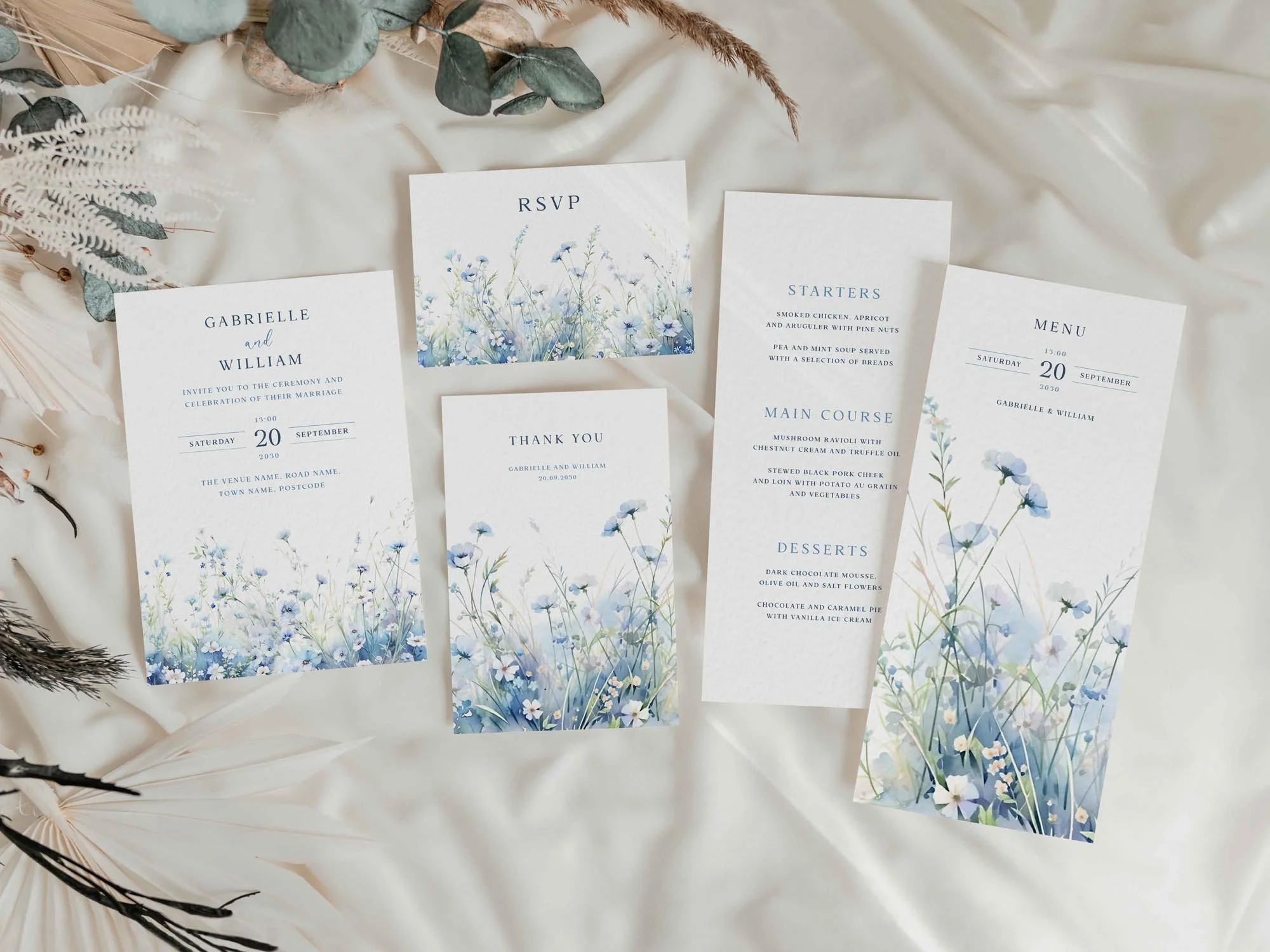 Wedding stationery suite featuring dusty blue wildflowers